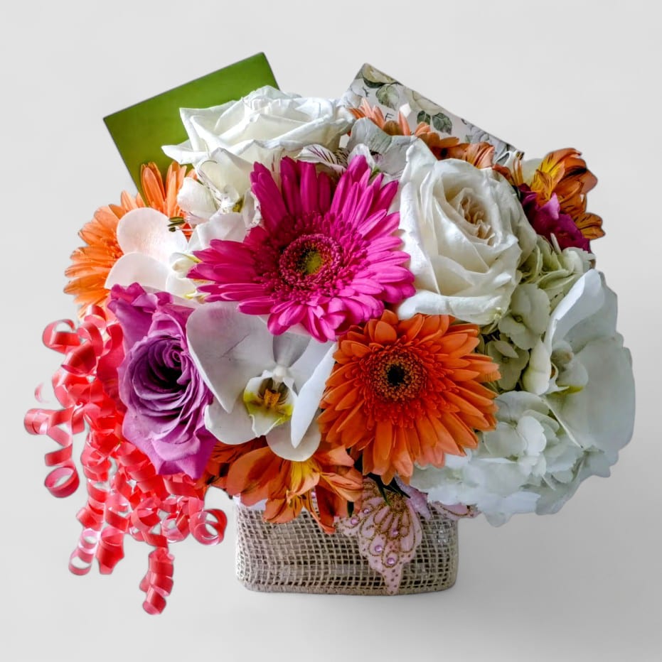 Happy Birthday Beautiful Cheerful Bouquet - Lovely roses orchids and so much more arranged in a modern glass cube vase wrapped in beautiful vanilla jute ribbon. Perfect size bouquet for sending to them for every occasion to show them how much you care. All of my bouquets are made special and unique each and every time. Please visit my beautiful gallery to see my most recent designs that I have created for my online customers. Send them happiness today.