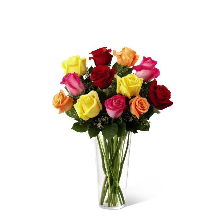 FTD Bright Spark Rose Bouquet - This spirited bouquet holds roses in bold hues - hot pink, orange, red  and bright yellow. Certain to be an attention-getter! These vivacious  roses are arranged with seeded eucalyptus in a clear glass vase. 