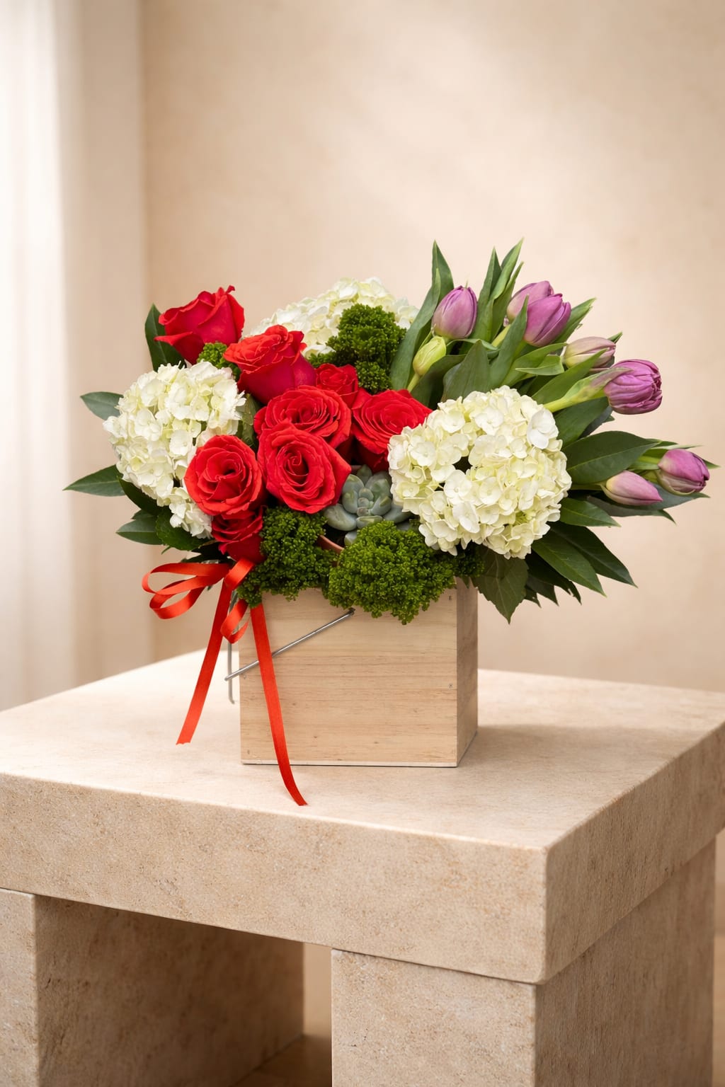 Scarlet Harmony  - A refined floral box featuring premium red roses, creamy hydrangeas, delicate tulips, and fresh green accents, elegantly styled in a modern wooden container. Perfect for romantic gestures, special occasions, or luxury gifting.
