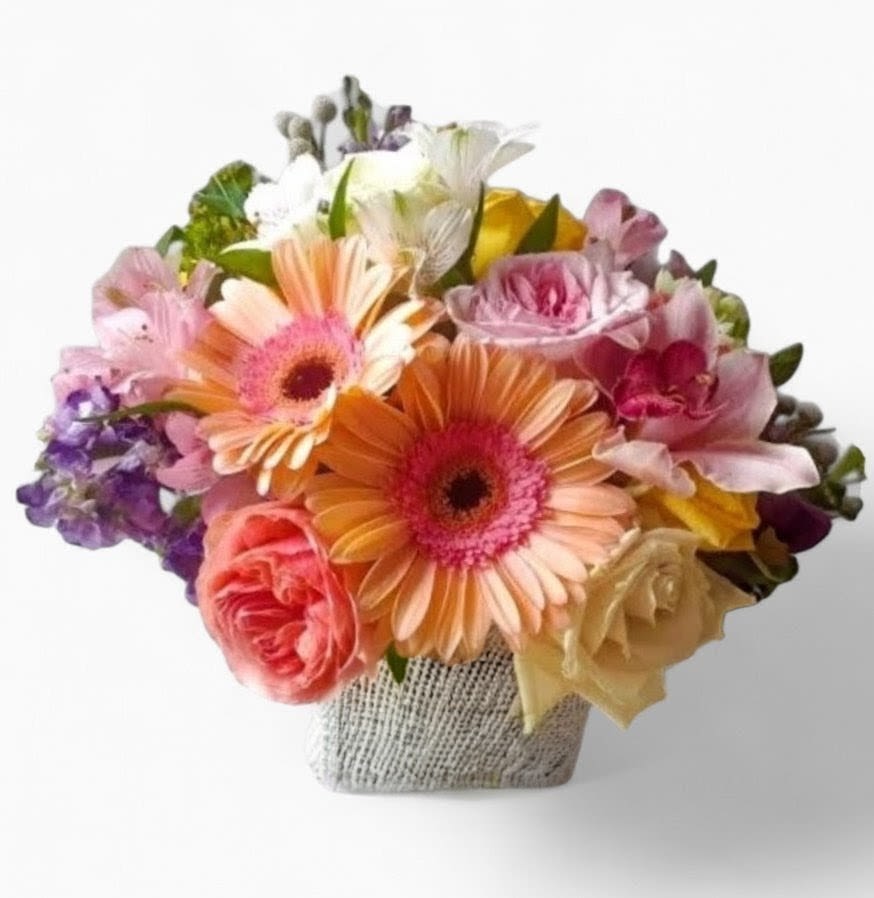 Blush Vanilla Birthday Bouquet Designer's Choice - Send this beautiful bouquet today to make them smile with it's lovely mixed vanilla and blush blossoms of the day roses hydrangeas and more arranged in a modern glass cube vase. Always made unique and extra special each time. Send happiness.