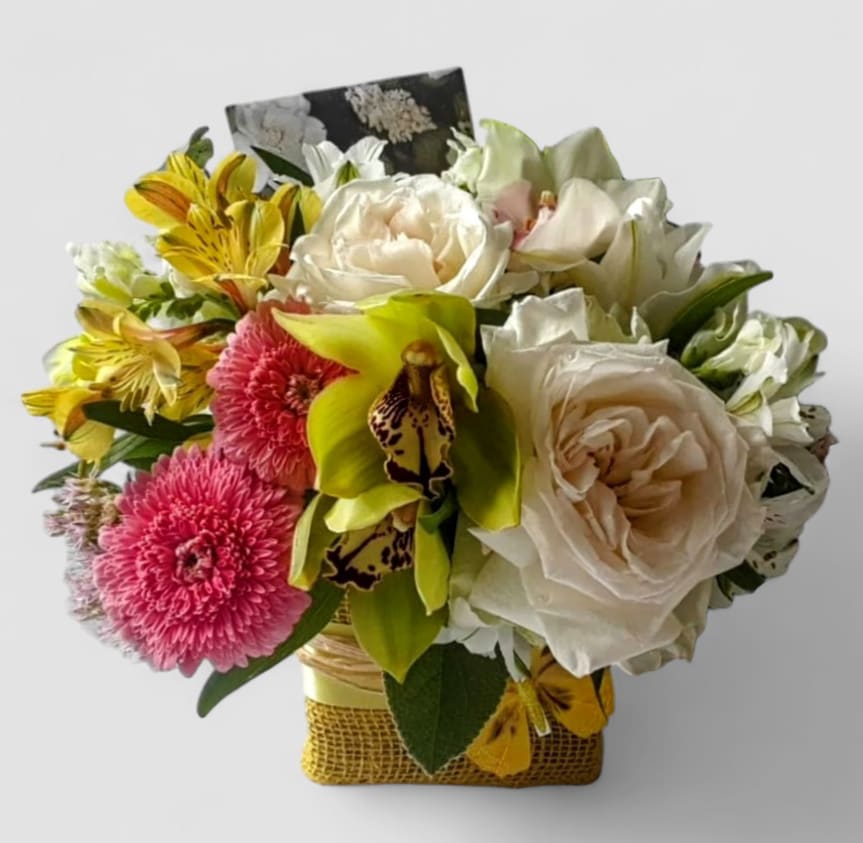 Candy Pink And Vanilla Rose And Orchid Beautiful Bouquet Designer's Choice - Perfect for every occasion. Send this beautiful bouquet today to show them how much you care with it's beautiful mixed pastel rose and orchid blossoms of that day arranged in a modern glass cube vase wrapped in cheerful yellow jute ribbon. Beautiful. All fresh flower designs that leave my studio are beautiful works of art, made special and unique every time with care. Please visit my beautiful gallery to see my latest designs that I have created for my online customers. Send them happiness today! Send them a special bouquet to make them smile. 