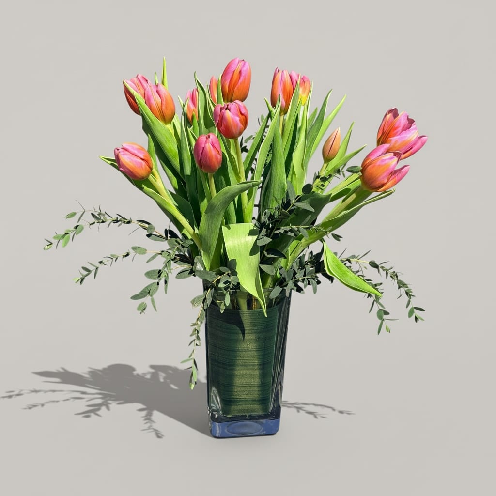 Pleasingly Pink  - Show how much you care with by sending these pink tulips. Pleasingly Pink is the perfect gift to cheer up a family member or friend.   Vase Subject to Change