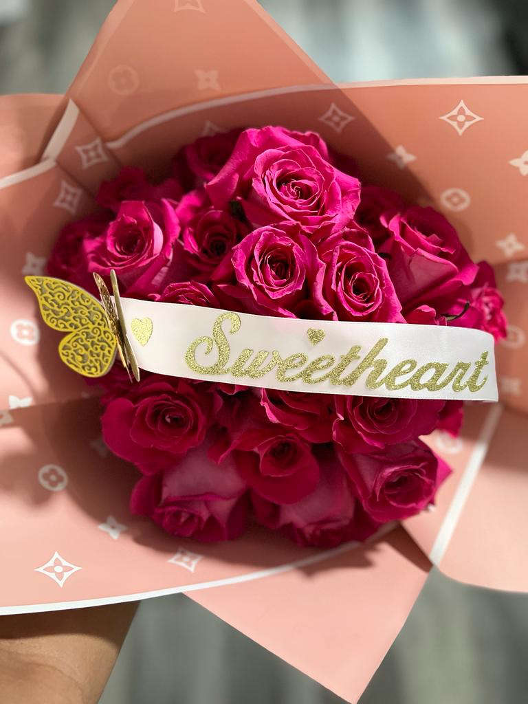 Luxury Rose Bouquet - Fresh hand-tied roses wrapped with luxury floral papers accented with diamonds, butterflies or crown and ribbons.   Standard size has 12 Stems. Deluxe size has 25 stems. Premium size has 50 stems.  Please note, stems are in water source. After 2 day or more, you may cut the stems and place bouquet in a vase of water with flower food packet.