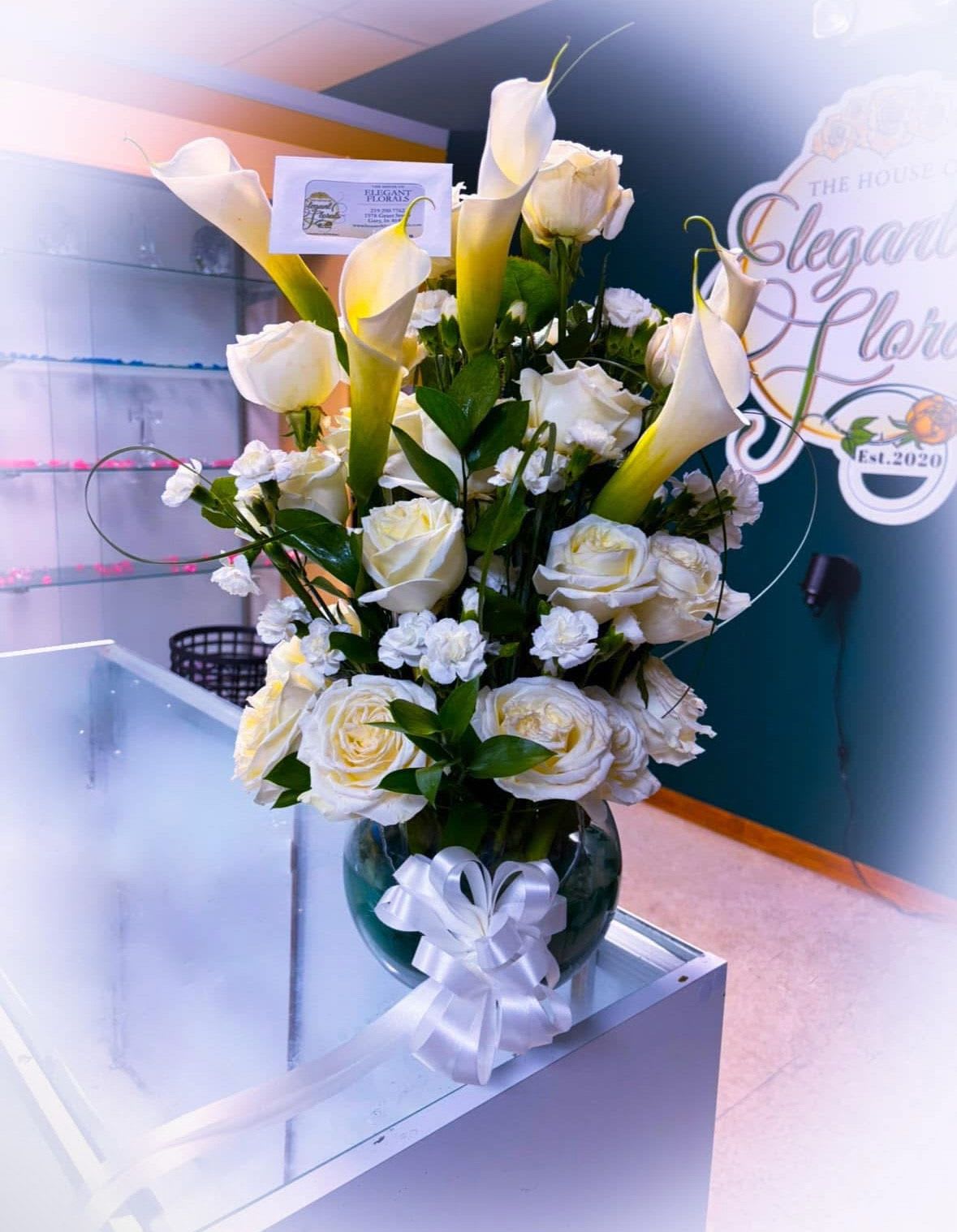 Fresh Bloom Vase Arrangement -  A luxurious blend of lilies and classic roses, arranged to complement each other in both shape and color.