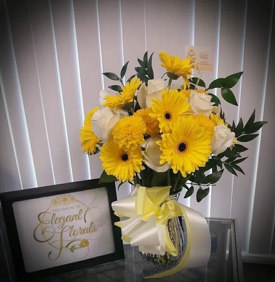 Sunny Sunflower Delight (Vase Arrangement) - This design was a big hit when first introduced. It’s beautiful fresh bright yellow sunflowers and white roses will add a boost to any setting around.