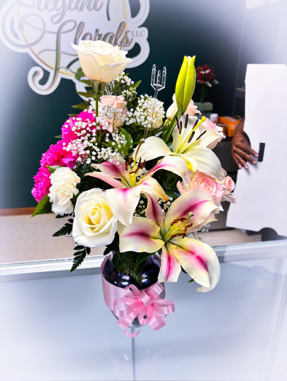 Pink Passion Combo - This beautiful vase Arrangement is a combination of white roses, pink carnations, and pink/white lilies. 