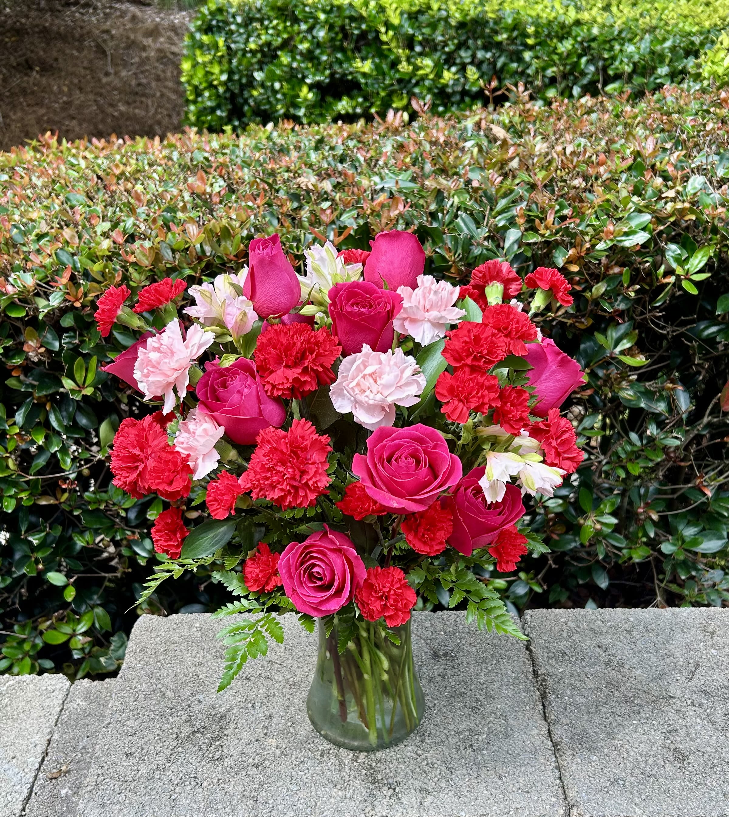 Pink Blossom Bliss - This elegant bouquet combines varying shades of pink, from soft pastels to vibrant hues, featuring roses, alstroemerias, carnations, and mini carnations. It embodies the essence of beauty, love, and femininity, making it the perfect choice for celebrations or moments of heartfelt affection.