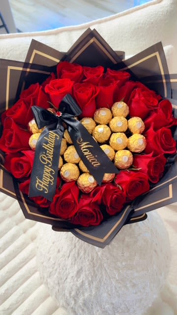 "Luxury Love &amp; Chocolate" - 18 roses/custom ribbon for any occasion  A stunning bouquet of premium red roses paired with irresistible Ferrero Rocher chocolates, wrapped in sleek black with gold accents. The perfect romantic gift to say “I love you” with elegance and taste. 