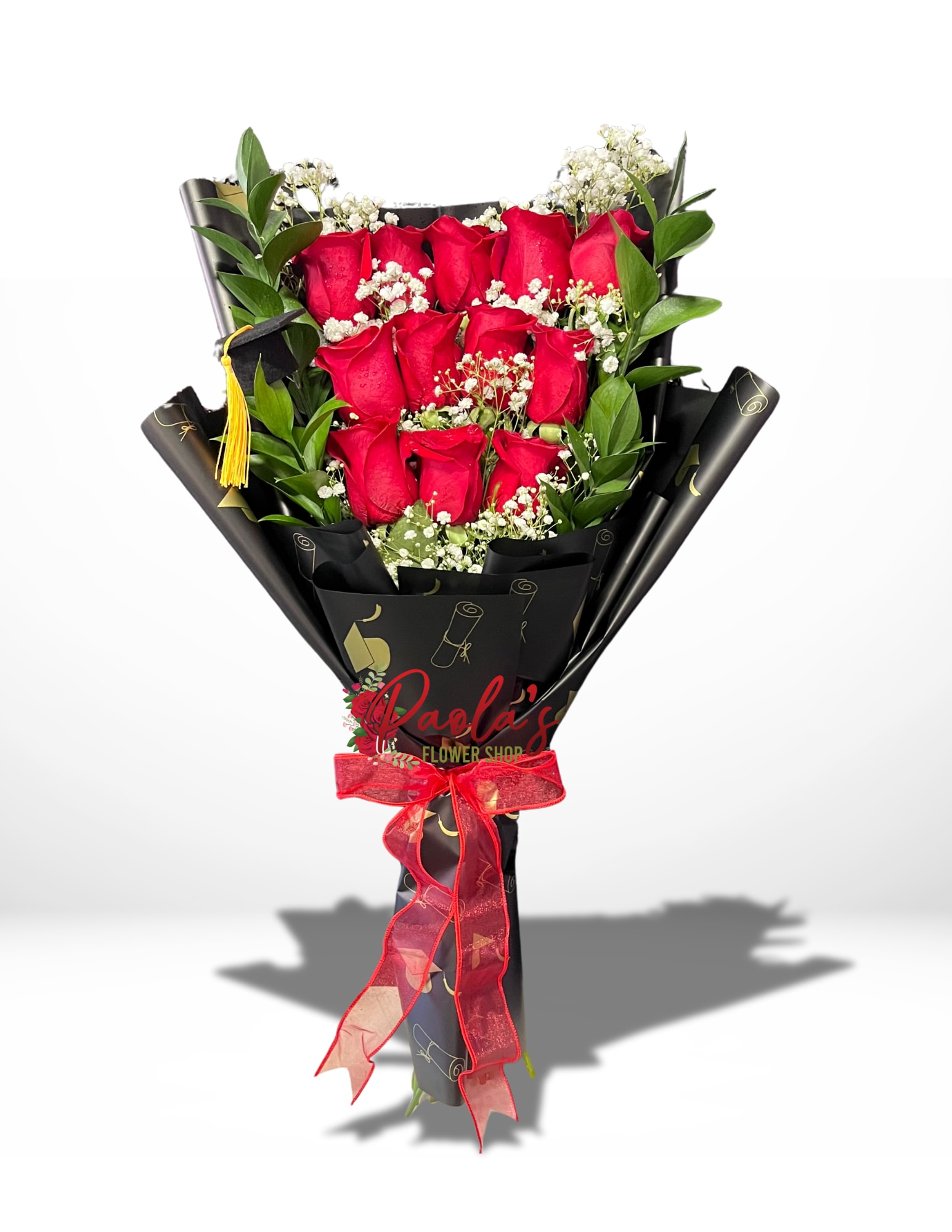 Graduation  bouquet  - Dozen roses adorned with baby’s breath and greens wrapped in graduation themed paper