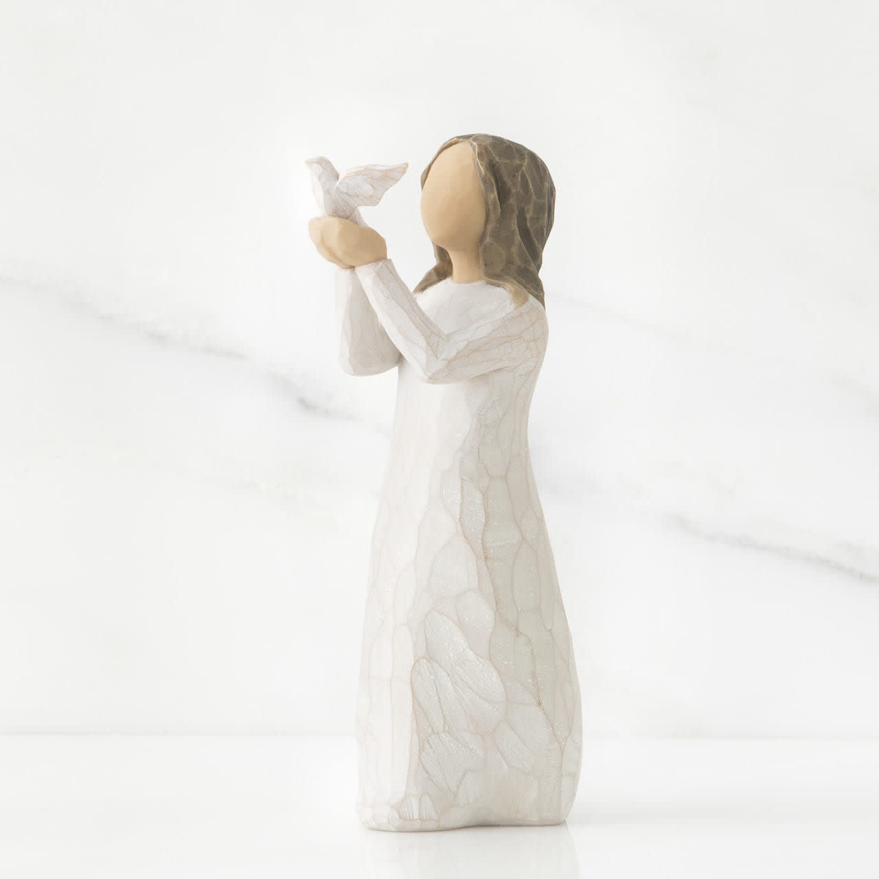 WILLOW TREE - SOAR - A gift for graduates or to celebrate special accomplishments…to encourage, support and acknowledge individual strength. 5”h hand-painted resin figure Standing figure in cream dress holding a white dove on extended arms Packaging box includes enclosure card for gift-giving Dust with soft cloth or soft brush. Avoid water or cleaning solvents