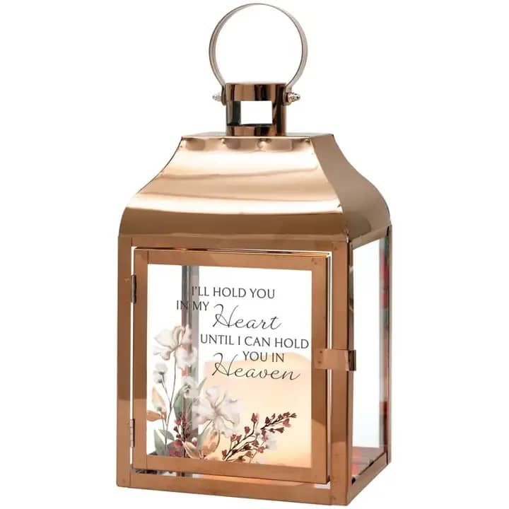 Lantern - In my heart - These lanterns are made with a high quality metal finish and uv printed glass artwork with sentiment. The flameless LED candle features a built in automatic timer 6 hours ON/18 hours OFF. 3 AAA batteries are not included. These lanterns are intended for indoor use only. Lantern Reads: "I'll hold you in my heart until I can hold you in Heaven"