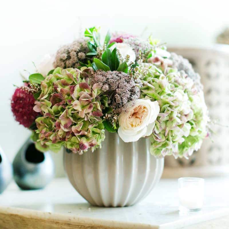Pure Antique  - An arrangement incorporating antique hydrangea accompanied by a mix of soft blooms and rich textures perfect for the late summer and early fall.  