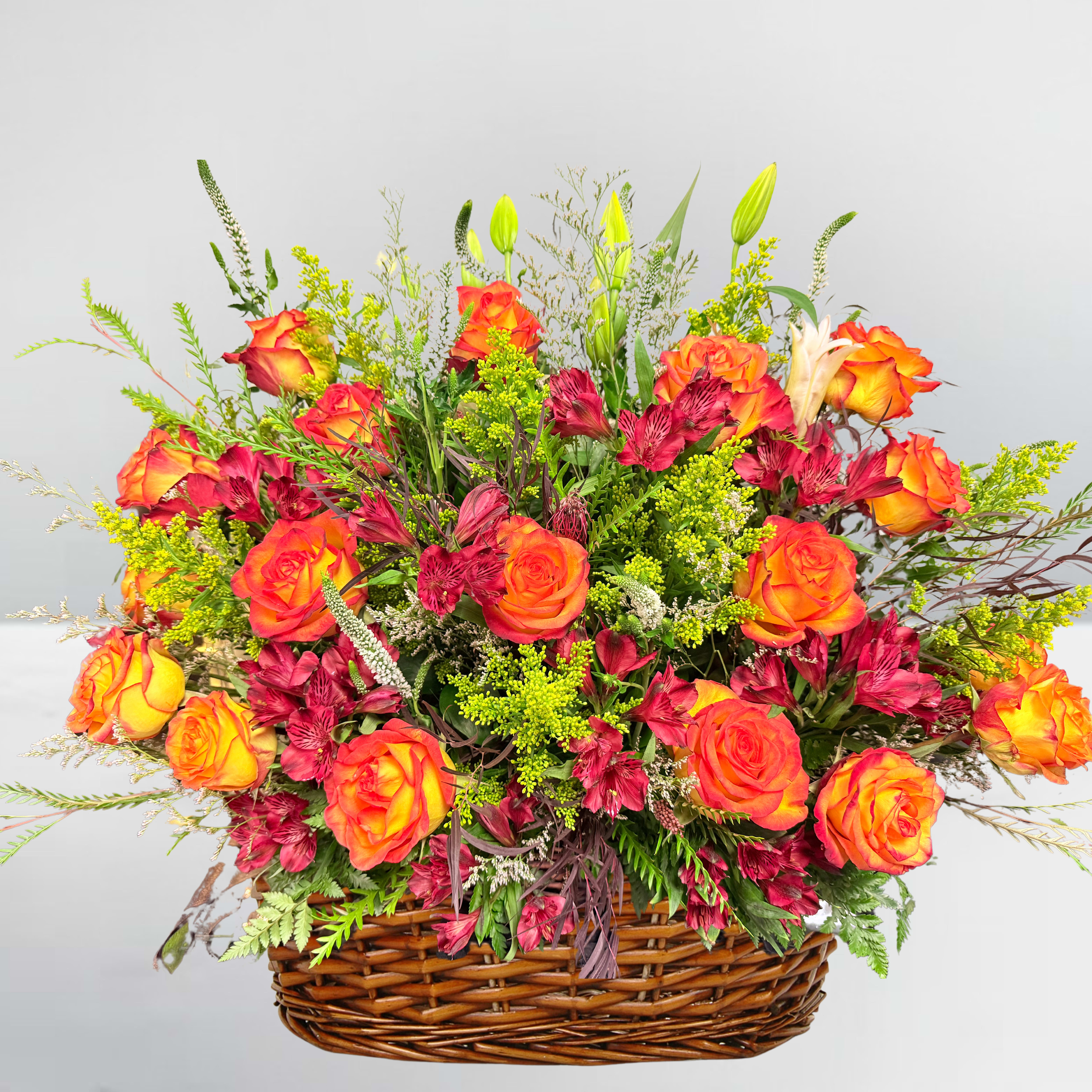 Fallon skies basket - Show Love with our beautiful Fallon skies basket including highen orange roses, Alstromerias, carnations, lilys, and soladago. This is a popular arengement for sympathy flowers to honor Fallon residents. 