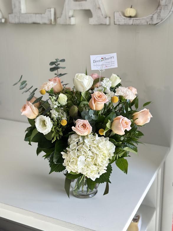 Gratitude  -  mix roses with alstroemeria, eucalyptus , hydrangea carnations , and billy balls  20h x 16w overall arrangement size 