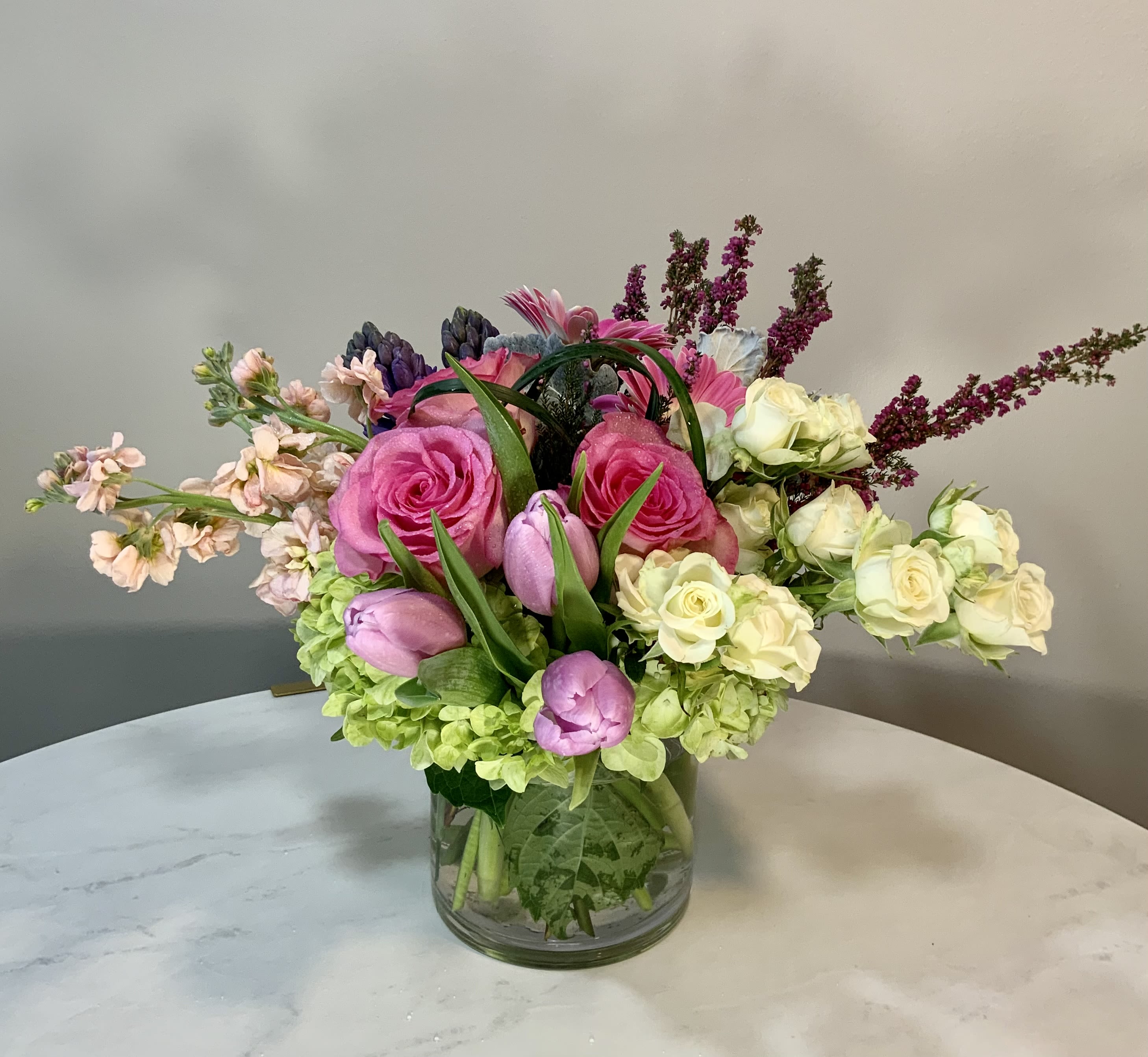 Dolores  - Roses, tulips, Gerber Daisies and green hydrangea. 6 x 6 in vase