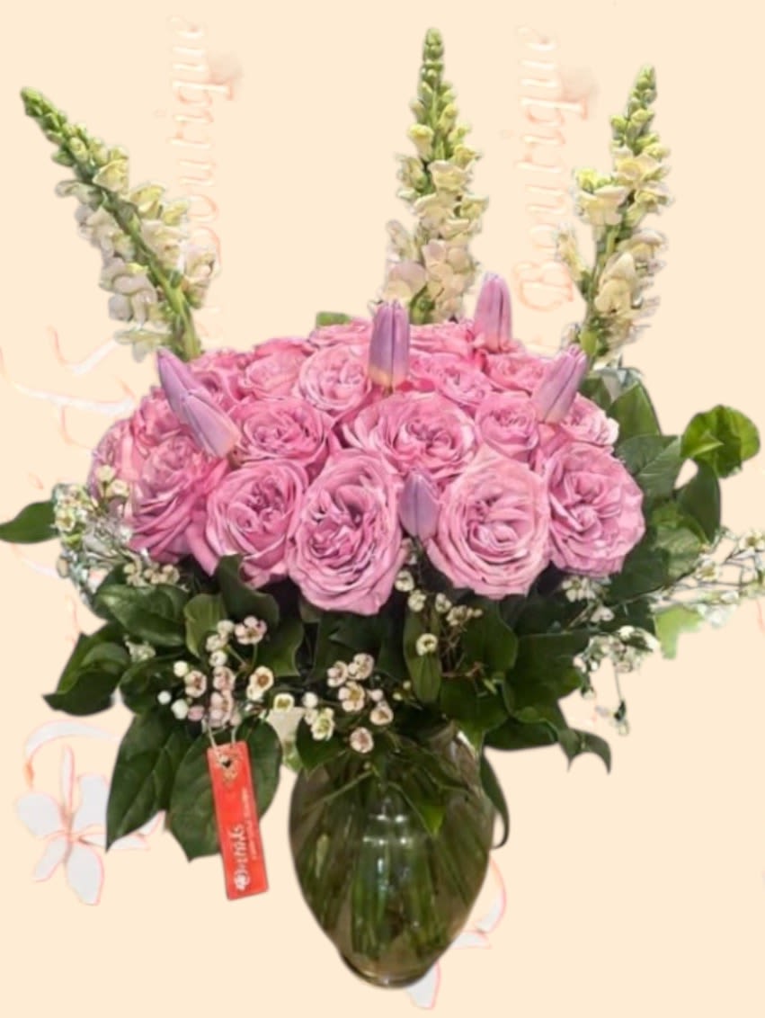 Elegant  Garden Lavender Roses &amp; Tulips Bouquet  -  Arrangement measures approximately 18- 22"H Arrangement of two, four, or five dozen lush, large-headed garden lavender roses, each with soft, full petals for a romantic and sophisticated look. Interspersed are elegant, pale pink tulips and white snapdragons, adding height, contrast, and a modern touch. The garden roses are complemented by subtle green filler foliage and wax accent flowers, enhancing the bouquet's natural beauty. Presented in a clear glass vase.  Perfect for: Anniversaries, birthdays, Mother's Day, or to brighten someone's day with elegance and charm.