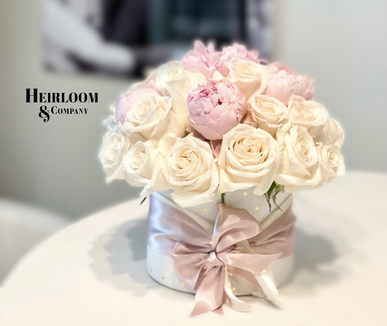 Love story - Inspired by one of our favorite songs, this beautiful hat box is filled with our premium hand selected garden roses, along with a dash of peonies.