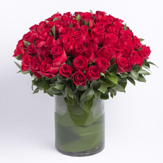 Century of Roses in RED - This is the ultimate Rose arrangement , 100 Beautiful Red Roses, shown here in a 10 inch tall cylinder Vase, wrapped inside with a leaf