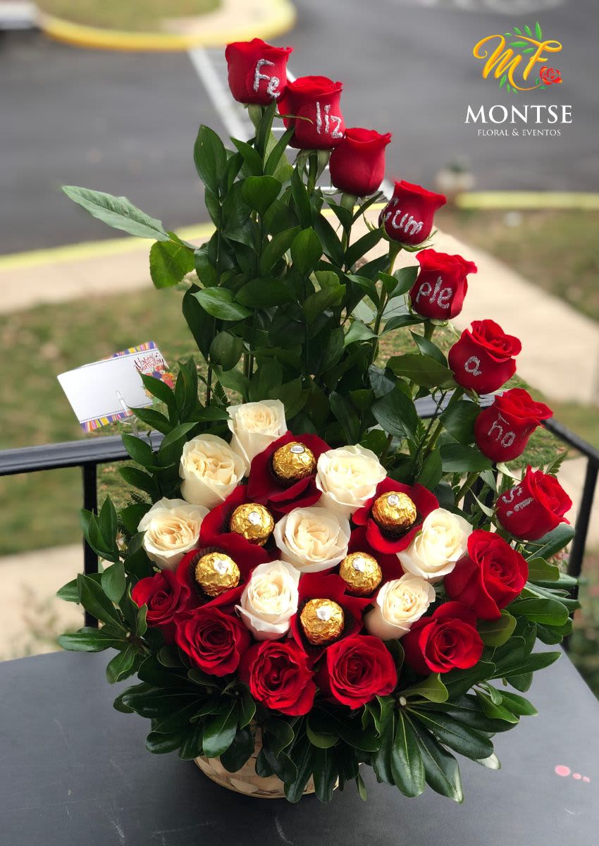 Te Amo  - 22 red and white roses and greens with 6 Ferrero Rocher are include in this beautiful Arragement