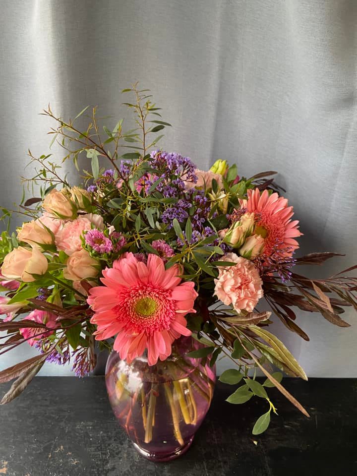 Pink Passion -  Lillies Roses alstroemeria, Stock, with fresh greens arranged in a clear gathering Vase