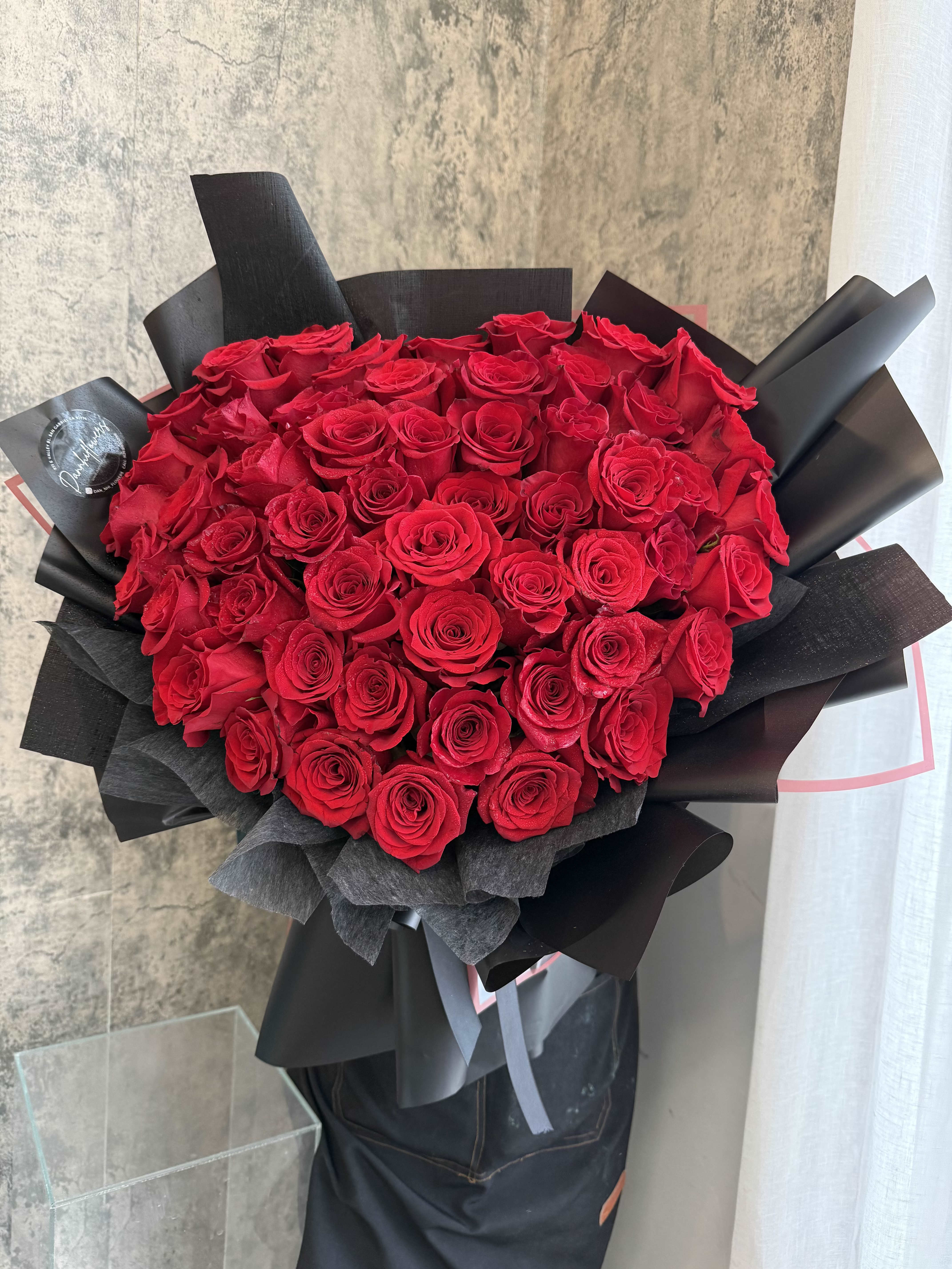 Forever Yours. - A heart-shaped arrangement of classic red roses, thoughtfully designed to express love in its purest form. Timeless, romantic, and beautifully balanced, perfect for moments that matter most. Standard size 20" Deluxe size 26"  *Photo is at Deluxe size.