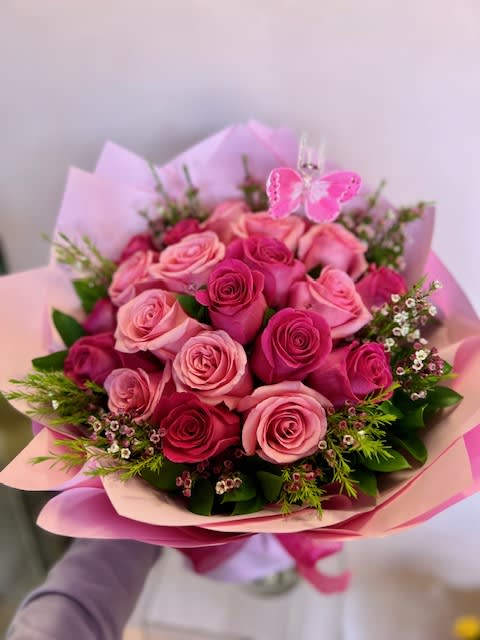Barbie Buchon- 24 assorted pink roses  - Whatever the occasion, give a gift that shows them, love. A fresh, hand-arranged bouquet of 24 assorted pink roses hand-tied. Sophisticated and stunning, assorted pink roses create a gift of the classic.  Foliage/Greenery selection will be based on seasonal availability.  We recommend following the below instructions upon receiving the arrangement:  1. Get a clean vase The cleaner your vase, the lesser the bacteria and the longer the flowers bloom. Of course, you can also use a jar, a mug, a teapot or anything that you fancy.  2. Fill with clean water Fill the vase with cold tap water. Too much water can speed the decay of the stems, and too little will hamper hydration. We suggest filling your vase up to two-thirds full.  3. Place in your vase Trim the stems, prune the lower leaves and arrange them in your filled vase however you like.  4. Place in a cool area Place your hand-tied bouquet in a cool room or shaded area. Avoid direct air-conditioning, direct sunlight, extreme heat, dust, and ripening fruit. All of these conditions may make your flowers wilt faster.