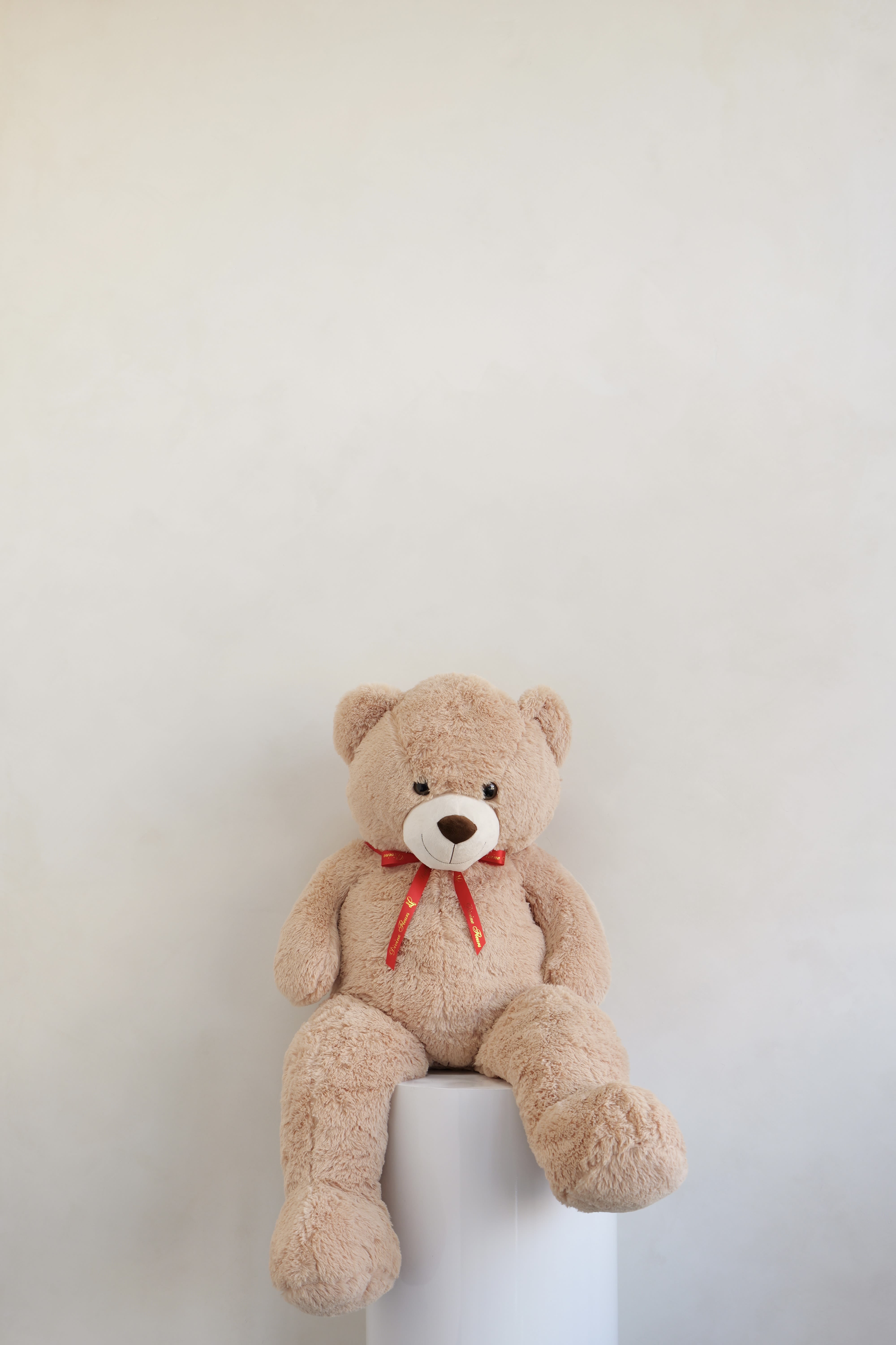 Grande Size Brown Teddy Bear - A cuddly brown teddy bear with ultra-soft plush fur and a classic red ribbon, perfect for adding a sweet and timeless touch to any bouquet or gift arrangement.