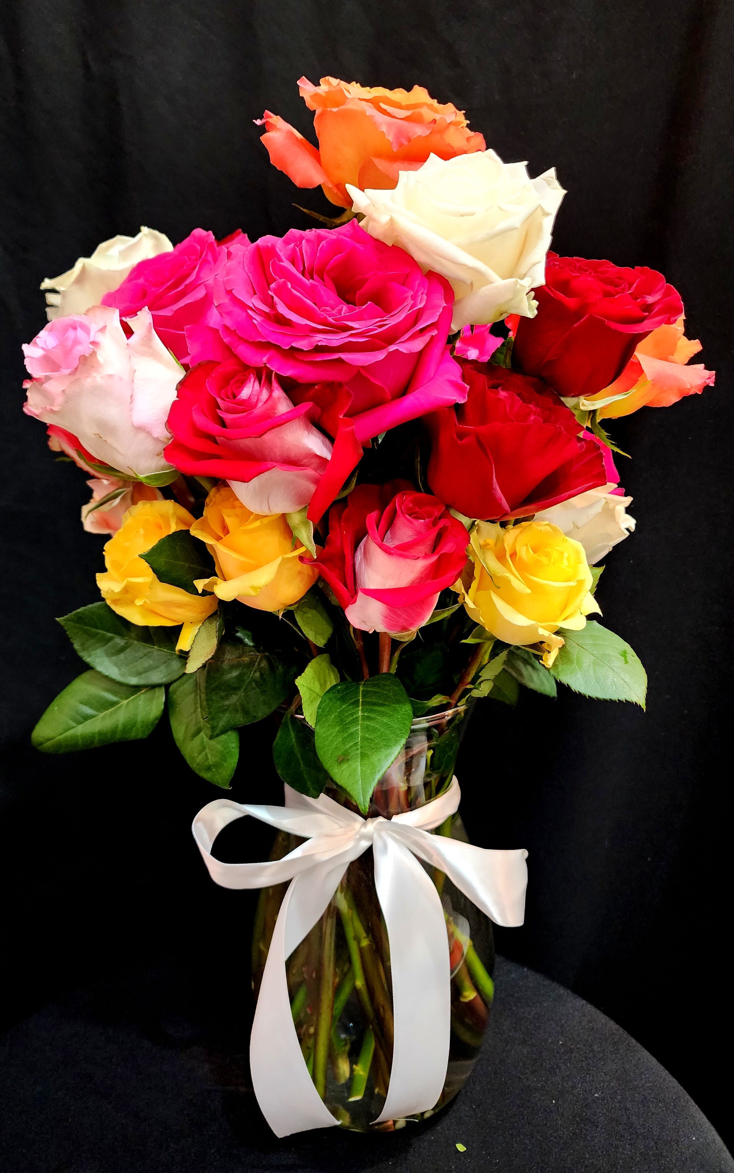 All about Roses - Mixed color roses. Red, Pink, Yellow, Lavender, and Orange Available.   Standard - 9 Roses Deluxe - 18 Roses  Premium - 26 Roses 