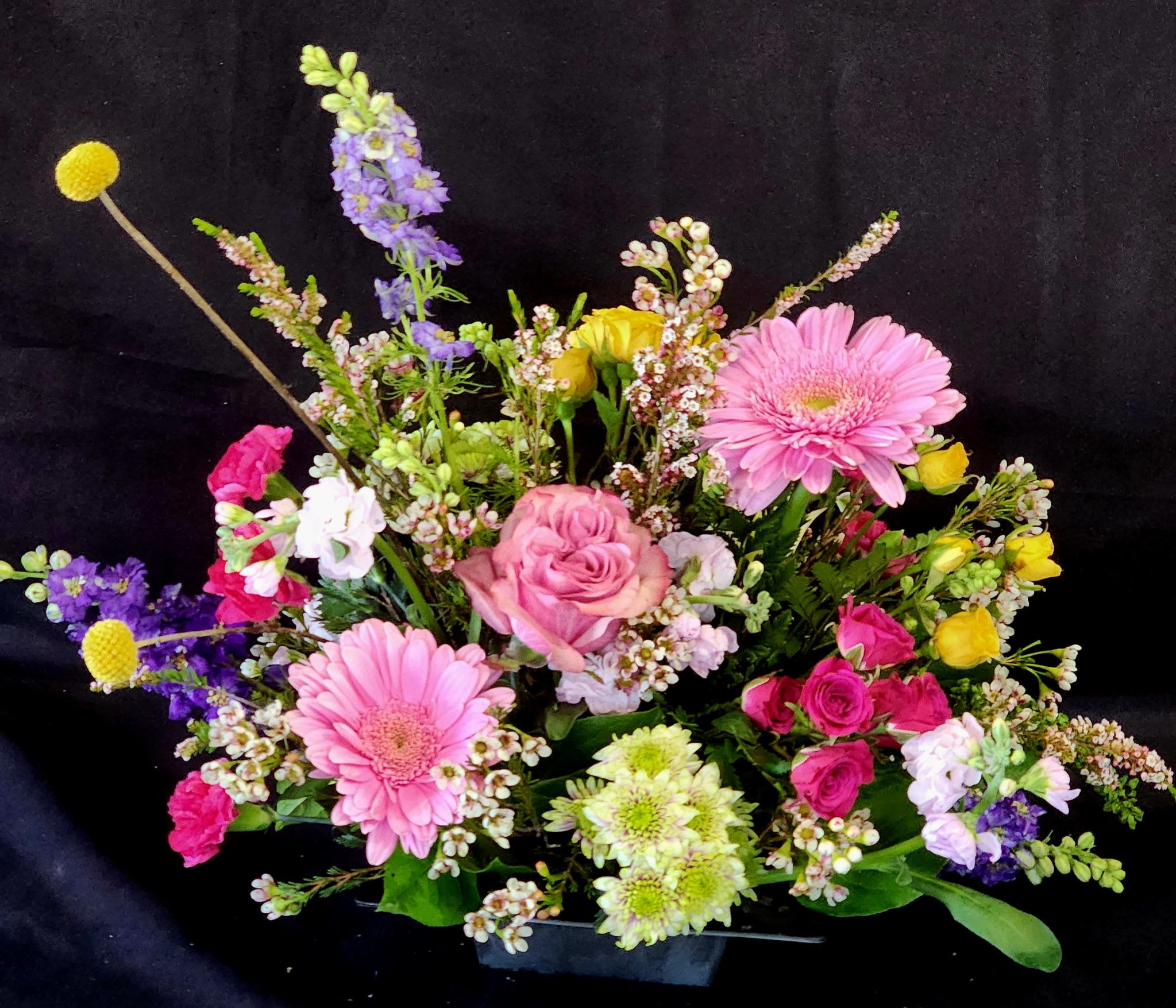Designer's Choice of Seasonal Flowers - Arrangements will be in a clear glass vase. 
