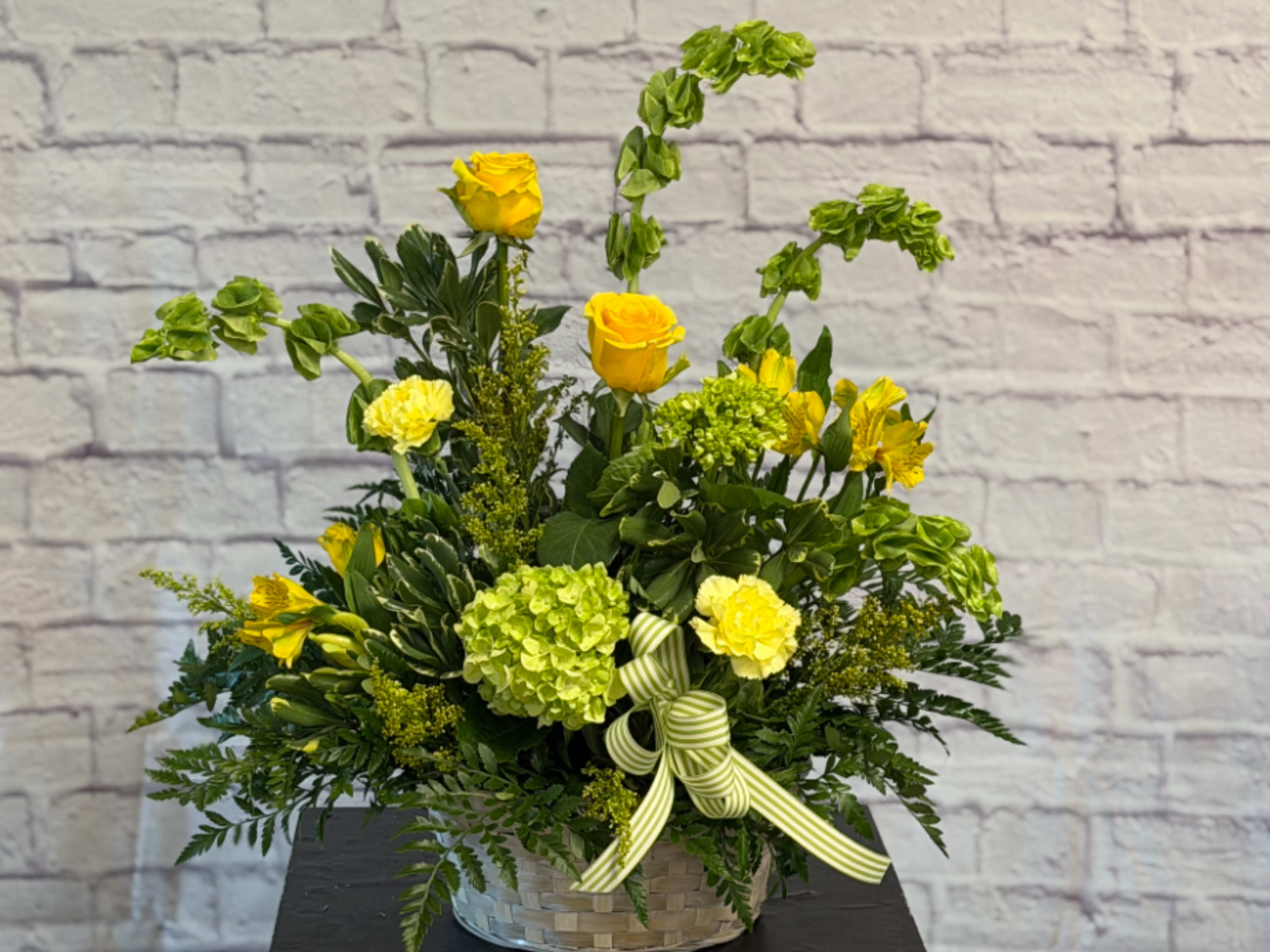 Sunshine Basket - Spread a little sunshine in someone’s life. Send them this beautiful floral gift of gentle blossoms in yellow and green shades – arranged in a basket – and they’ll remember your thoughtfulness for a long time to come.