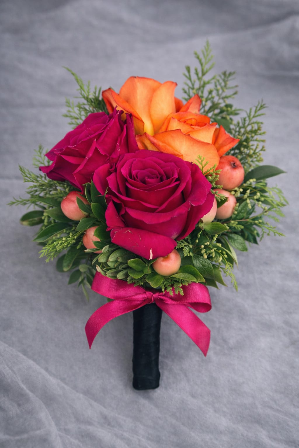Hot Pink Rose Boutonnière - A  finishing touch for a wedding or prom. Consisting of a carefully selected roses complemented with and greenery, It comes with ribbon of your choice of colors: black, gold, light blue, light pink, purple, silver, or white if the color you desire is not listed please give us a call or write in in "delivery notes" at checkout anyways. If we do not have it we will contact you.    If no ribbon color is mentioned in "delivery notes" at checkout we will make the ribbon like shown in photo. 