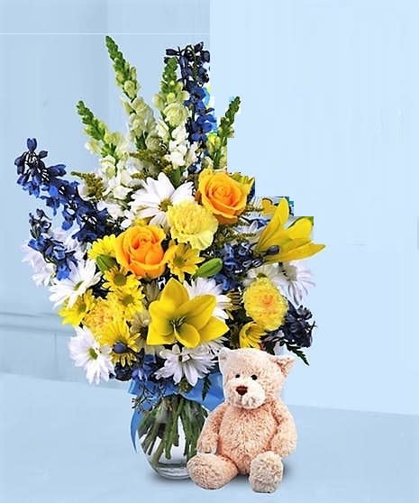 Its a Baby Boy flowers with Teddy Bear - Boy color flowers arranged in a vase and Teddy Bear.