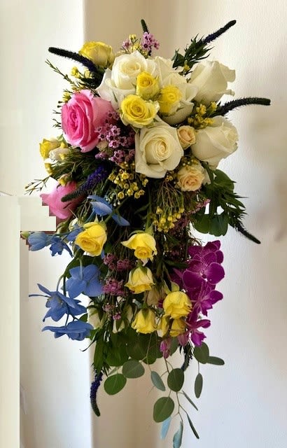 Bride's Bouquet - Bride's Bouquet with assorted colorful flowers. Designed Roses, Orchids and other flowers in a hand held Bouquet.
