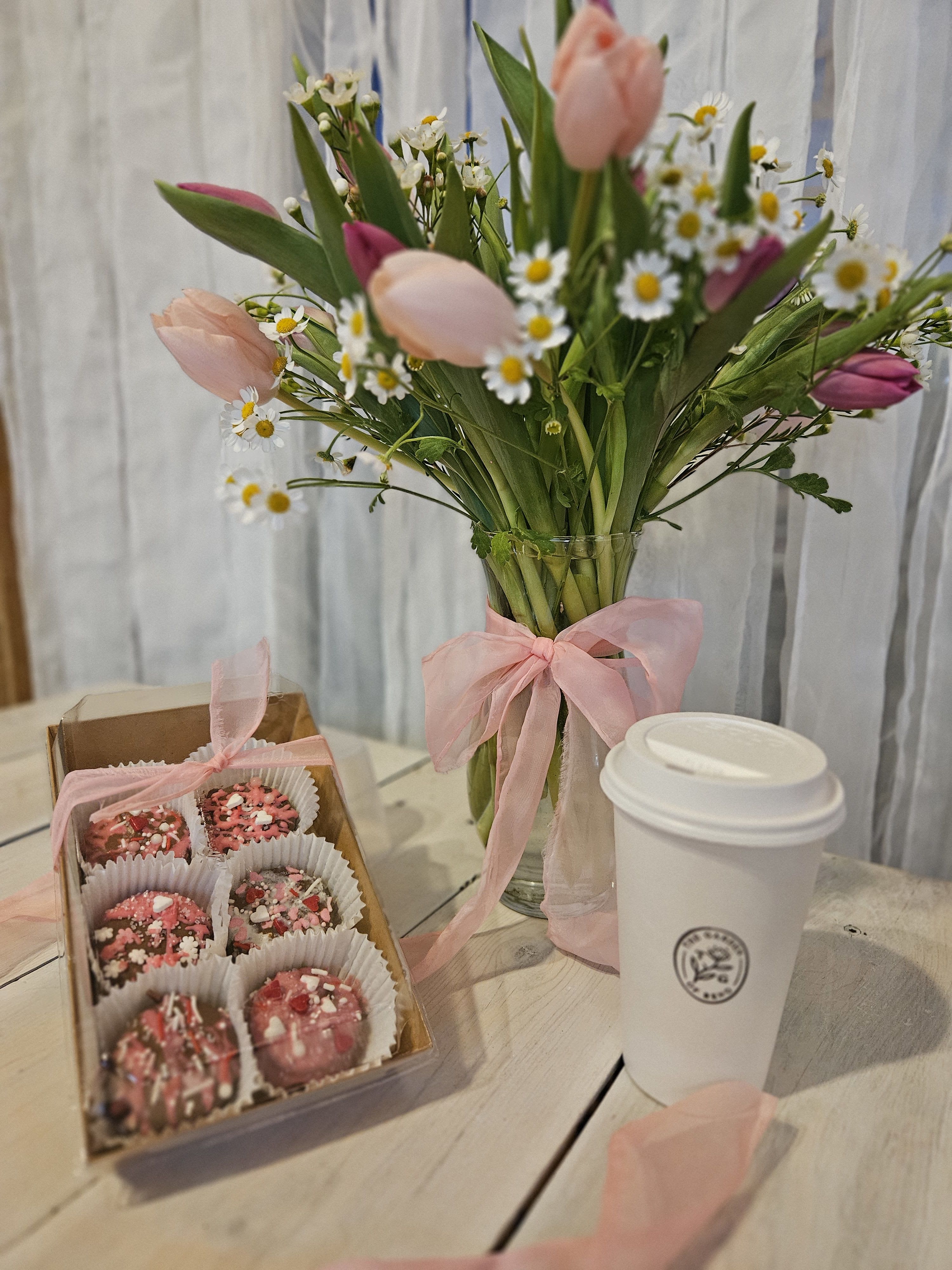 Tulips and Love - Beautiful tulips in a variety of colors designed to make your somebody feel very special.  This Combo includes 6 chocolate dipped oreos and a gift card for a free latte.  