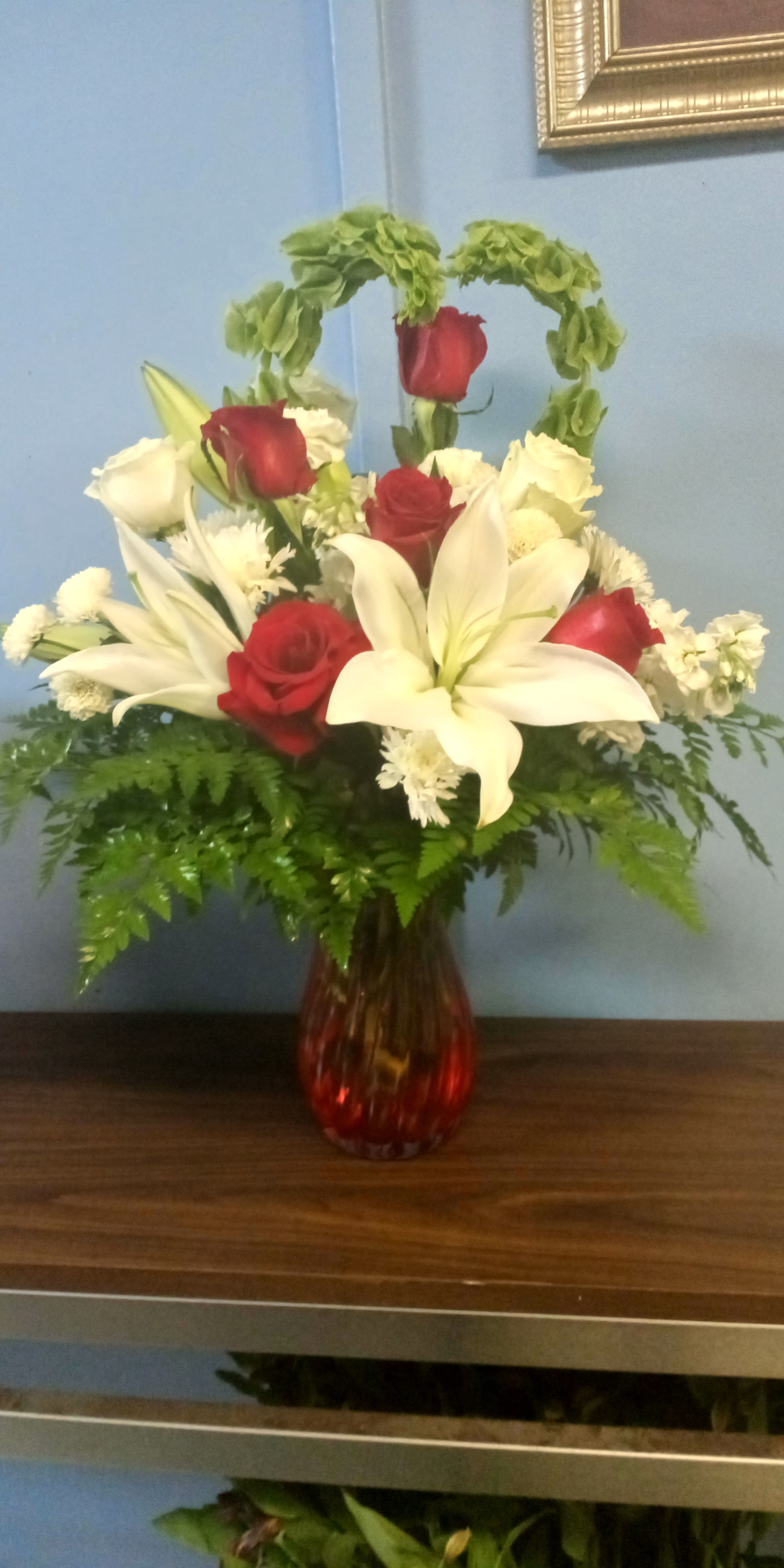 Don't Go Breaking My Heart - Don't go getting your heart broken because you forgot about Valentine's day. This beautiful arrangement is sure to get you brownie points. It's made with premium Oriental lilies, red and white roses in a crystal mauve vase.