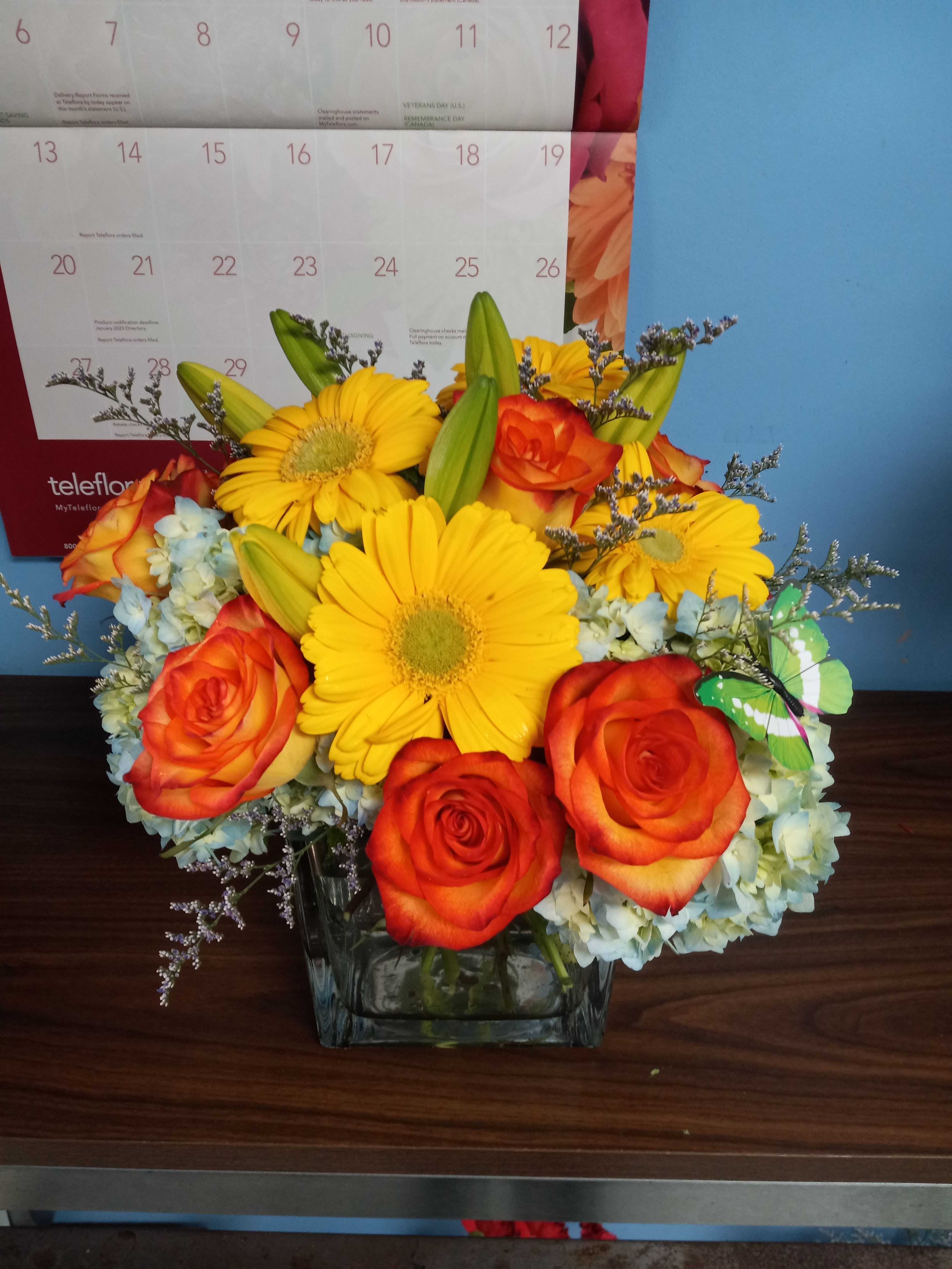 BLOWN AWAY - BLUE HYDRANGAS, ROSES, GERBERA DAISY IN  MODERN CUBE VASE