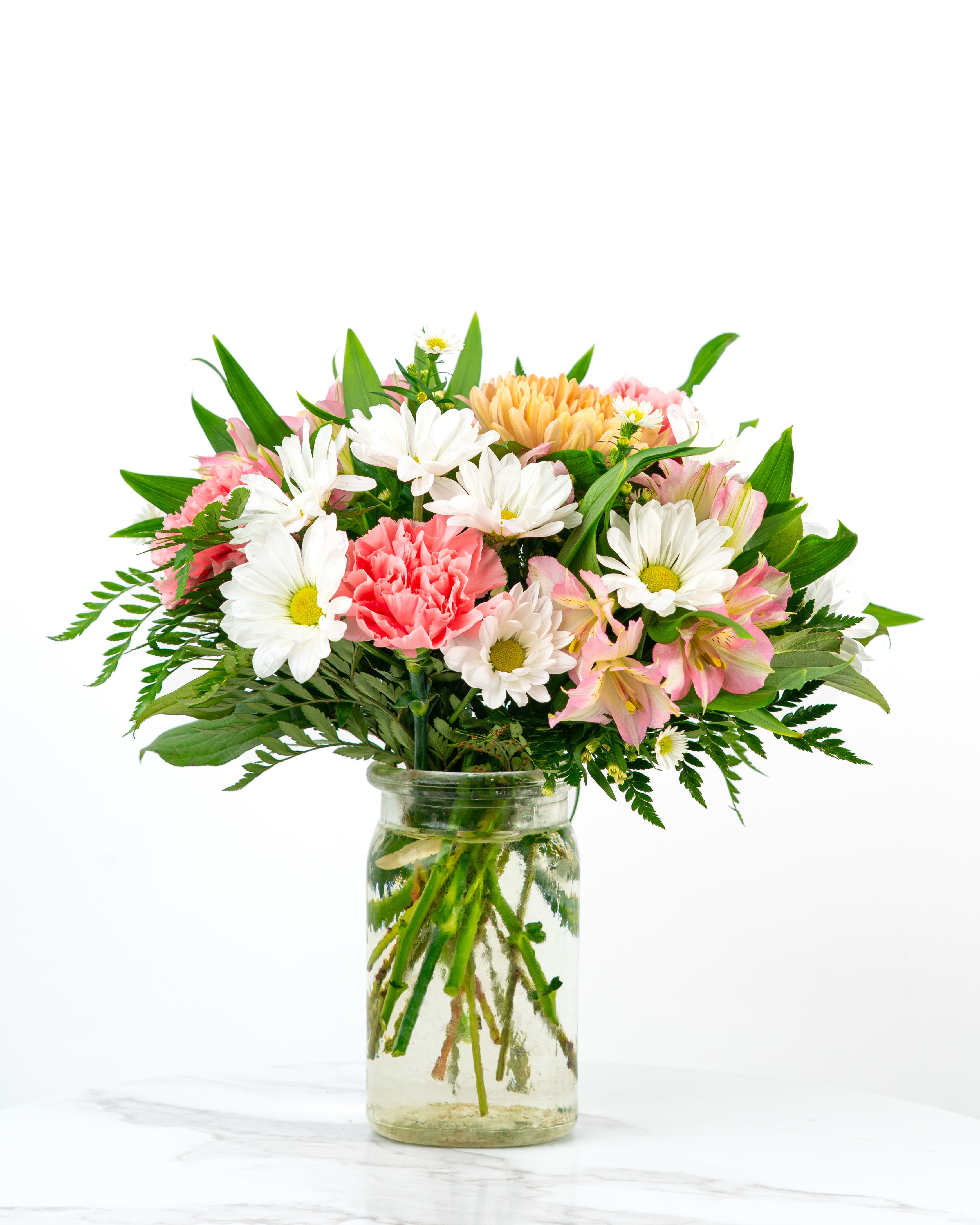 Our Rosy Collection: Pink Birthday Wishes - Looking for a pretty and pink way to wish someone special a Happy Birthday? Our Rosy Collection's Pink Birthday Wishes is intended to celebrate someone special with feminine color combinations, blending pink or coral florals into a festive arrangement that expresses love, charm, and heartfelt moments. At Schultz Floral, each arrangement is one of a kind and styled just for your order. Because we always use the freshest blooms, your final arrangement may not look exactly as pictured due to seasonal availability.