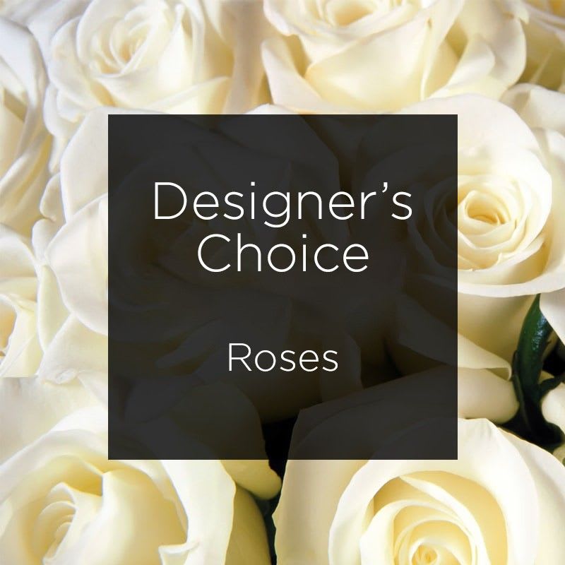 Designer's Choice  Assorted Color Roses - A dozen of our long stem roses assorted colors arranged in a glass vase will be completed with  Fancy Greens. Our designer will choose from among the variety  of colored  roses in our frig.  All our roses are long stem.  908-234-2900