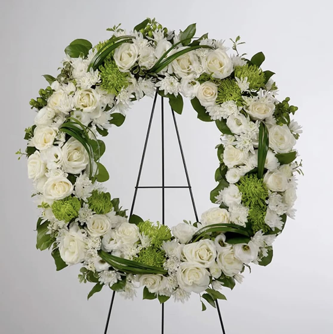 Lasting Serenity by BloomNation™  - A beautiful white and green tribute wreath that calms, this easel arrangement celebrates a full life and a peaceful passing. 