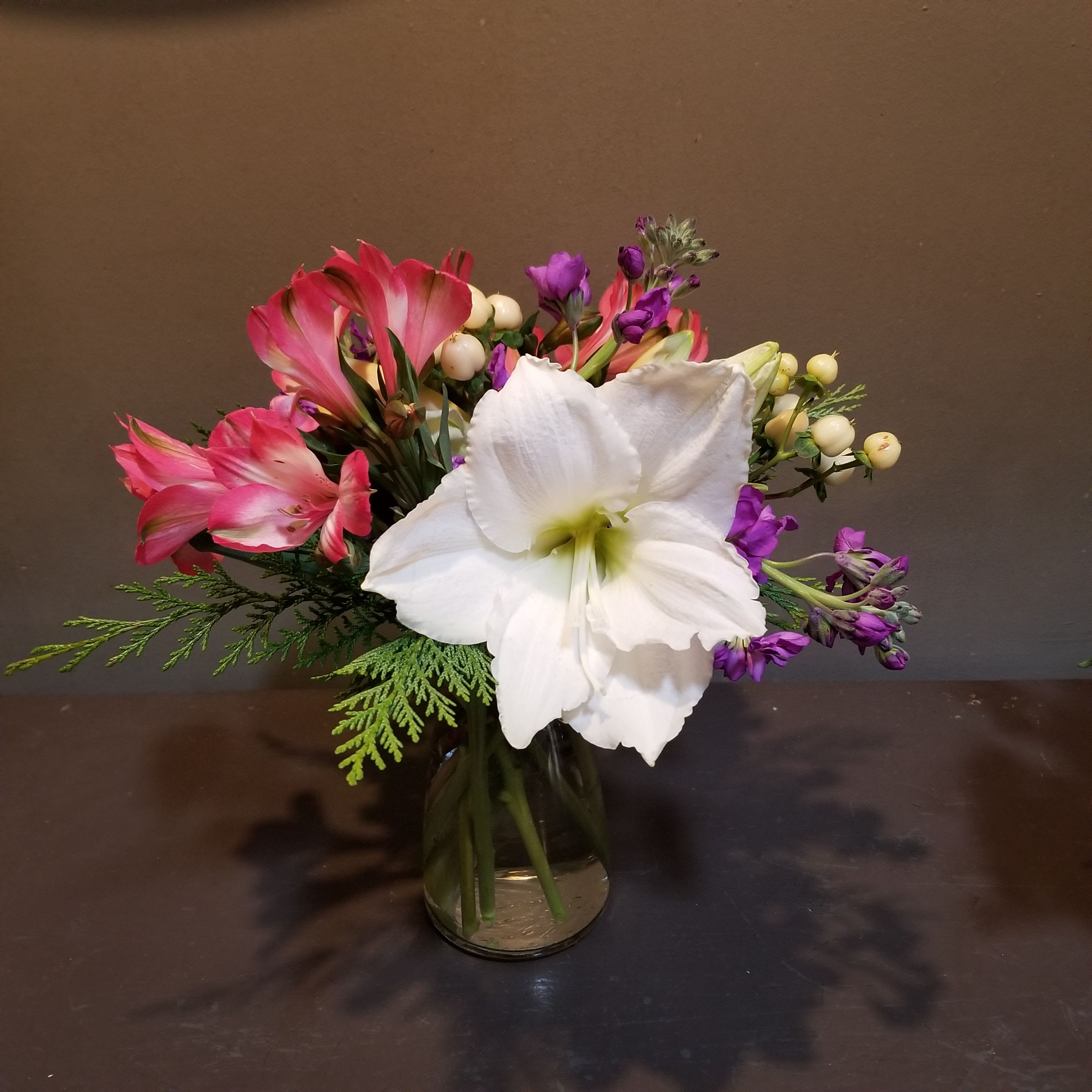 Springtime Joy - A sweet bouquet to celebrate spring in MN!  This arrangement measures 14"Tx11"W and arrives in a glass vase.
