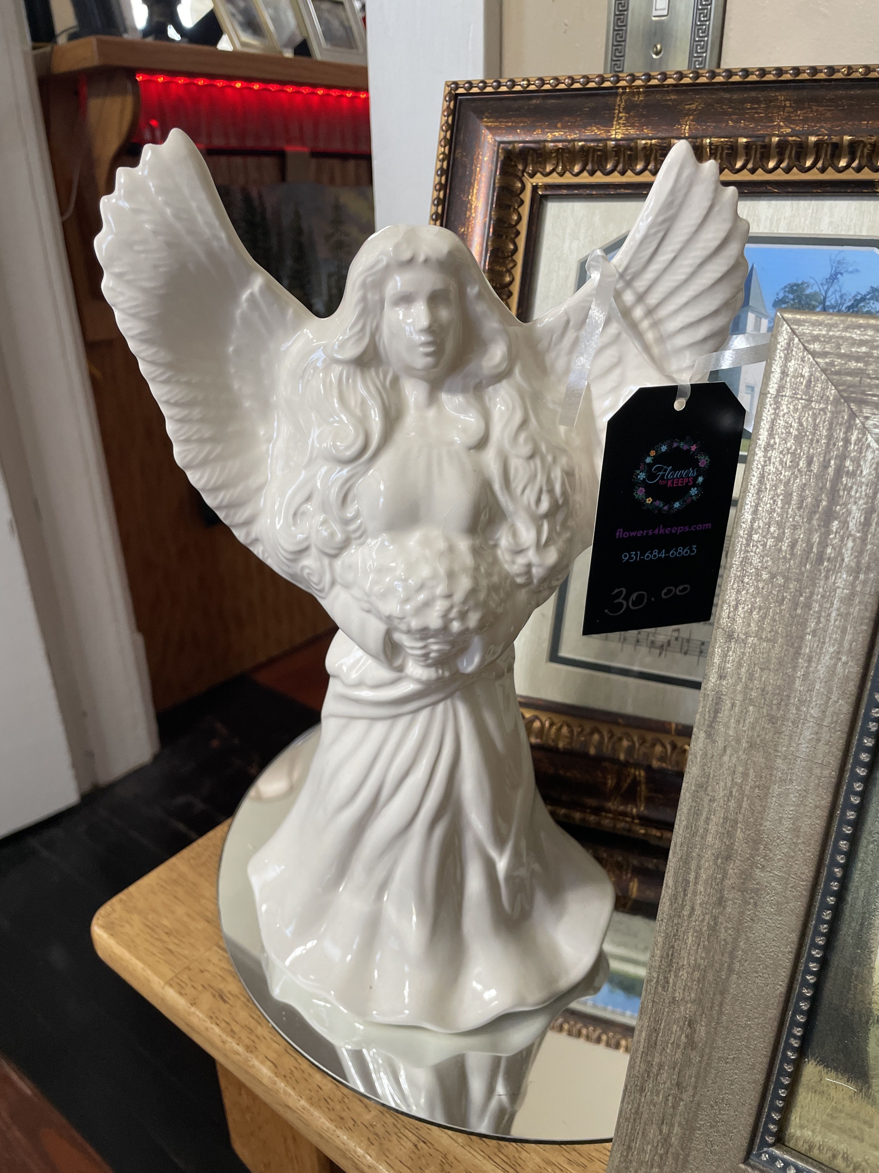 Peaceful Memories Angel - Handmade here in Shelbyville …  Keep the memories of a cherished loved one glowing brightly. Decorative porcelain angel figurine with intricate details. 