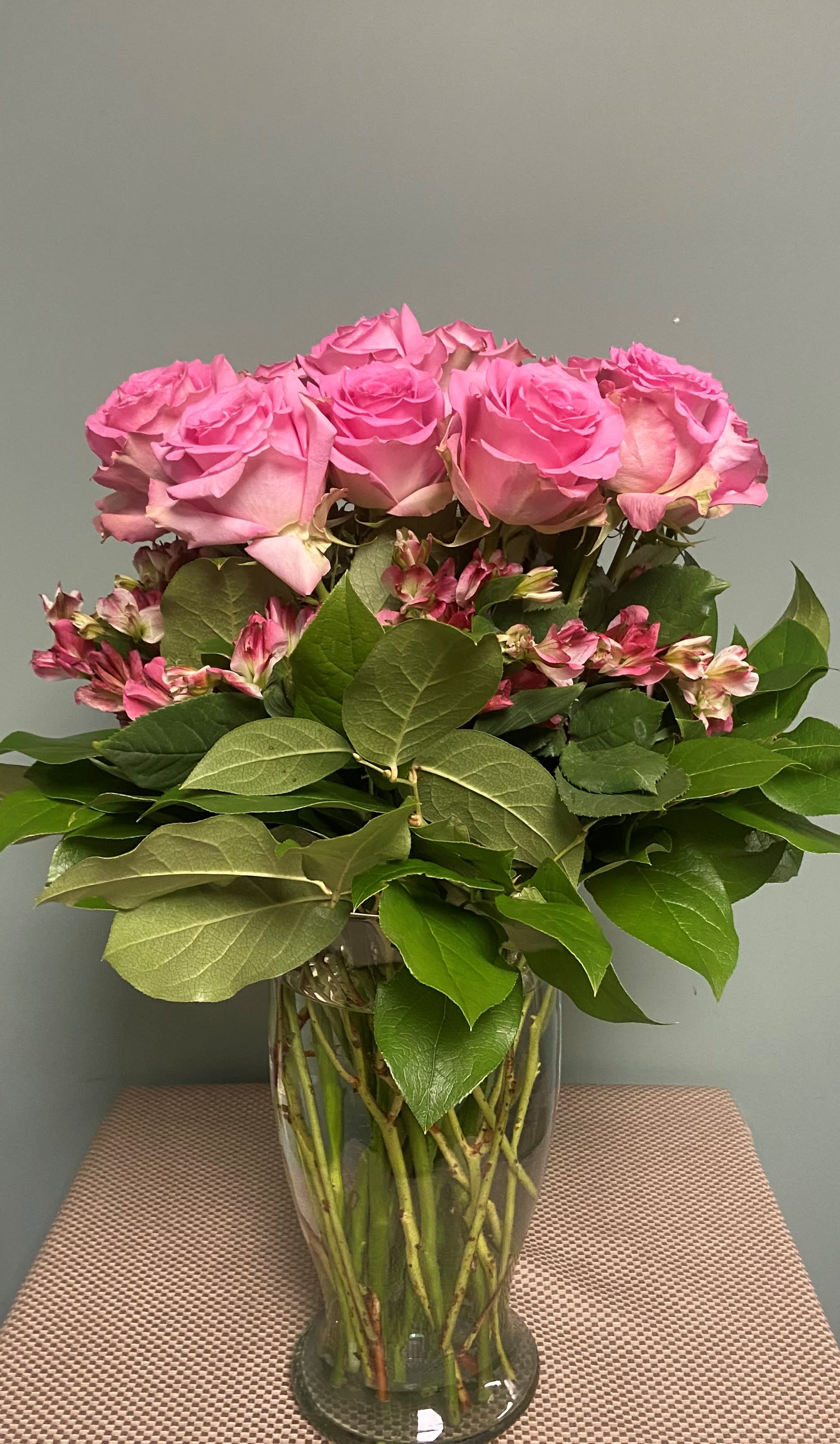  YOU ARE AMAZING!   PINK ROSE ARRANGEMENT - Our newest Premium Rose Feature, this exquisite arrangement is filled with PREMIUM ROSES in PINK.  The Roses are encircled by a layer of double floret PINK Peruvian lilies and then an outer layer or premium Salal greenery.  A truly striking and fresh take on the "Dozen  Rose Arrangement" 