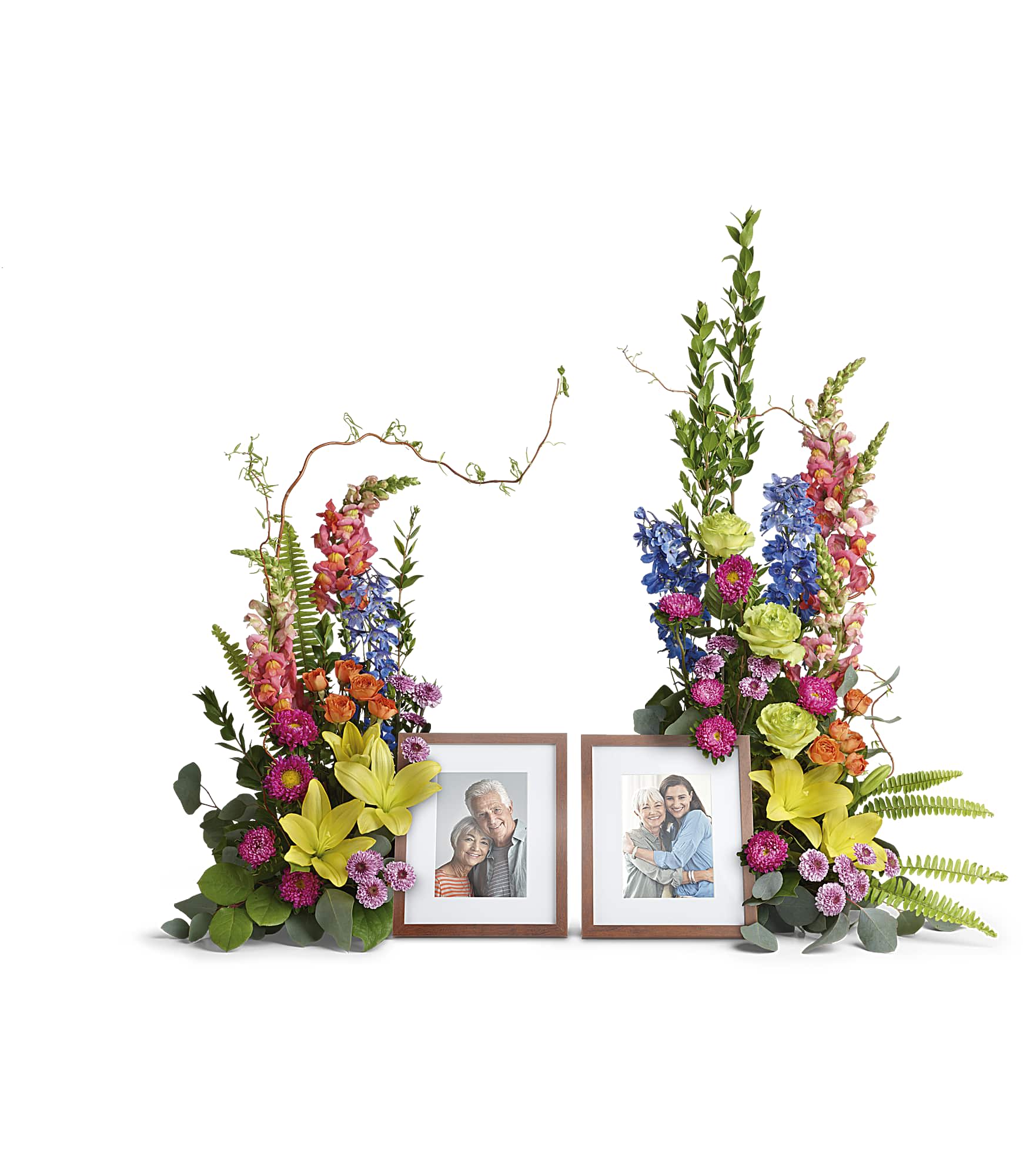 Loving Farewell Photo Tribute Bouquet - Add inspiring color to your loving farewell with this beautiful bouquet of roses, lilies and delphinium in all the shades of the rainbow. A breathtaking accent for beloved framed photos. Arrangement does not include picture frame.  33 1/2" H x 43 1/2" W