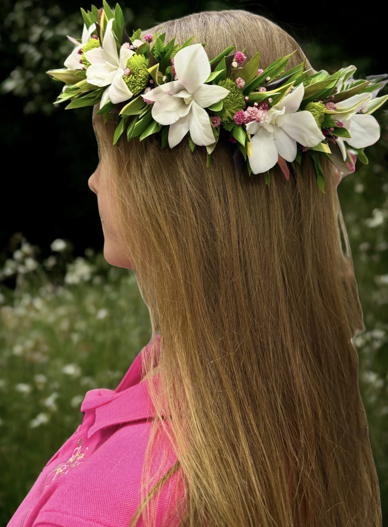 Landi's Lei Po'o - Radiate island beauty with this exquisite lei po‘o, handcrafted with white dendrobium orchids, cheerful pompon blooms, striking pink protea, delicate baby’s breath, and lush tropical greenery. The vibrant mix of textures and colors creates a stunning balance of elegance and aloha — perfect for weddings, hula performances, photo sessions, graduations, or any celebration of life and love.