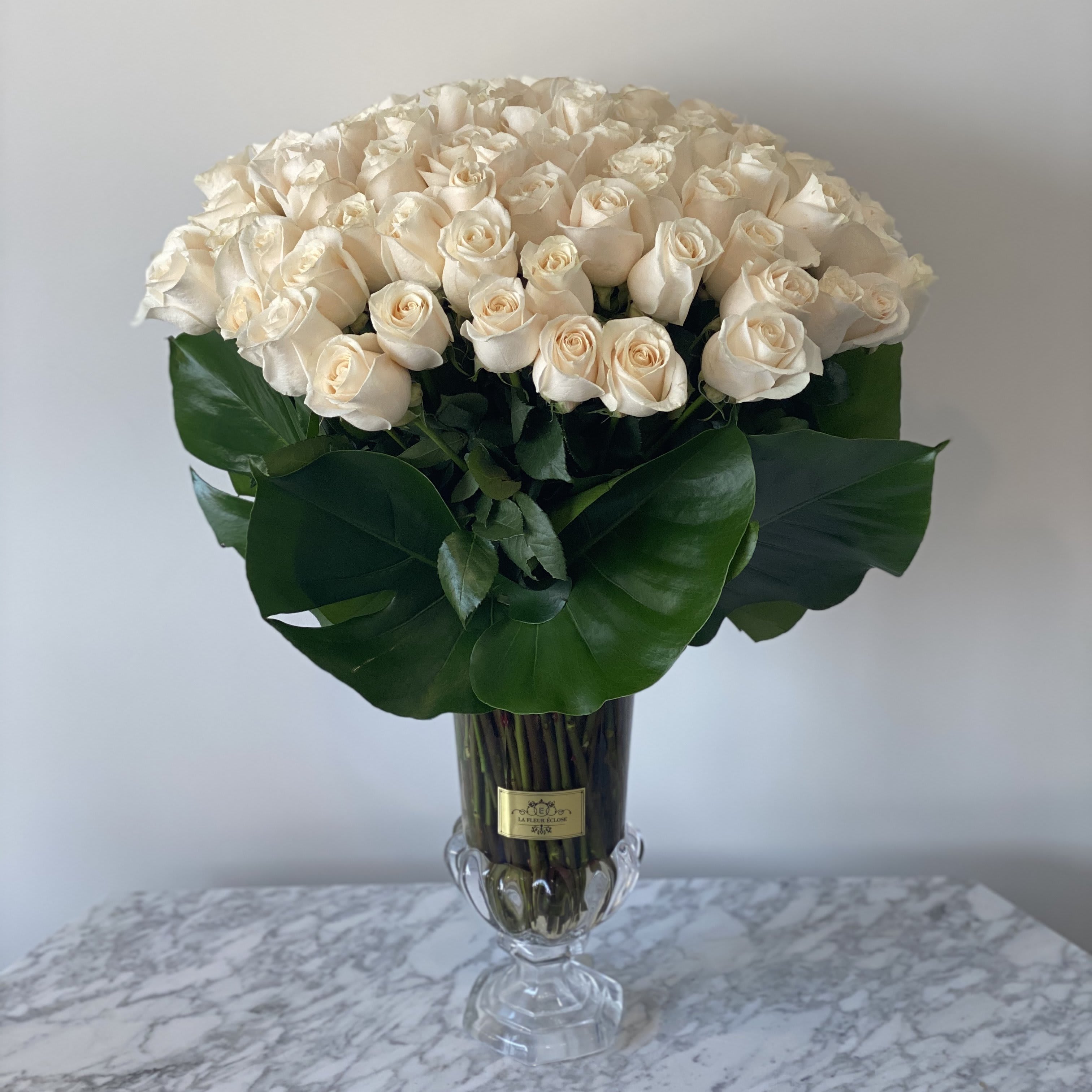 For You My Love  - 100 Stunning white roses in our clear vase with granary. 