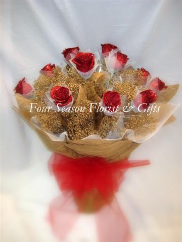 Hong Kong Style Roses - Red Roses Wrapped in Gold - A Dozen Red glittered roses arranged in gold wrapping paper and white netting arranged with gold sprayed baby''s breath.  Vase included.  As Shown : HKSR-029   *** GRADUATION HONG KONG STYLE ROSES, PLEASE PHONE-IN  Hong Kong Style Roses WRAPPED ( without a vase) will come with water tubes/water pouch.   Recommended for graduations!  Additional $20  