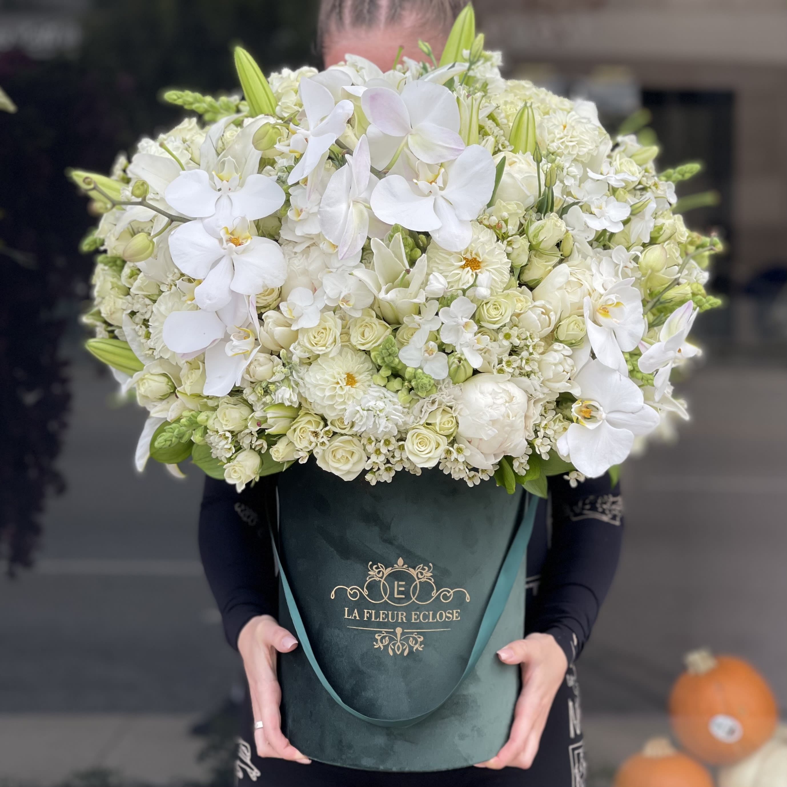 Green and white beauty  - Beautiful white color arrangement in velvet green box .                 Standard – pictured                     Deluxe – the amount of flower will be bigger. We will also put more premium flowers into the arrangement. 