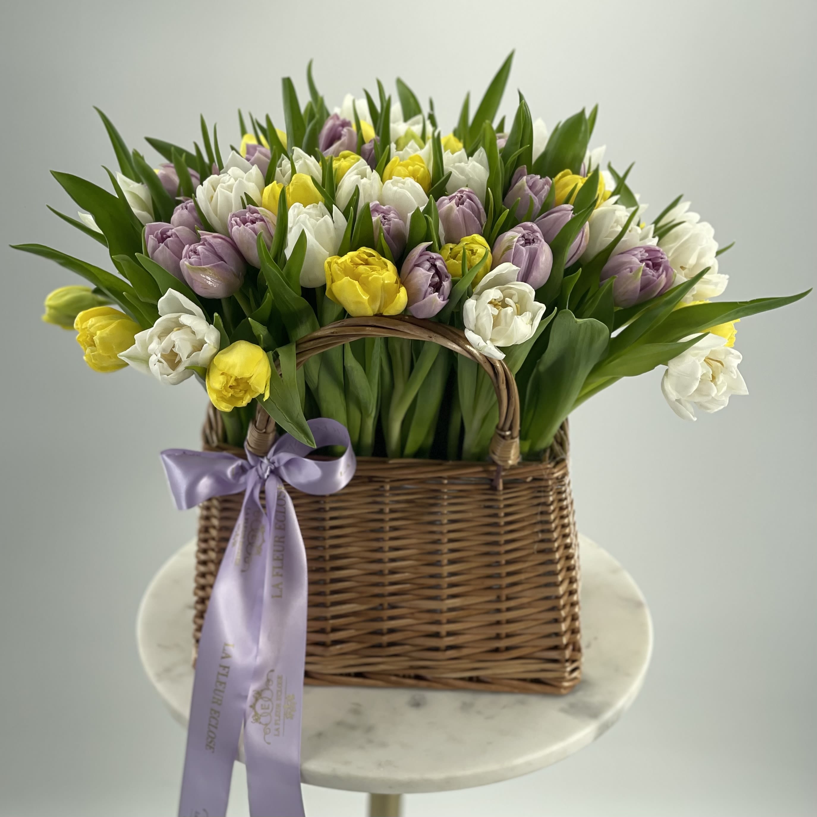 Bag with the Tulips V - 50 Fresh tulips in a basket .