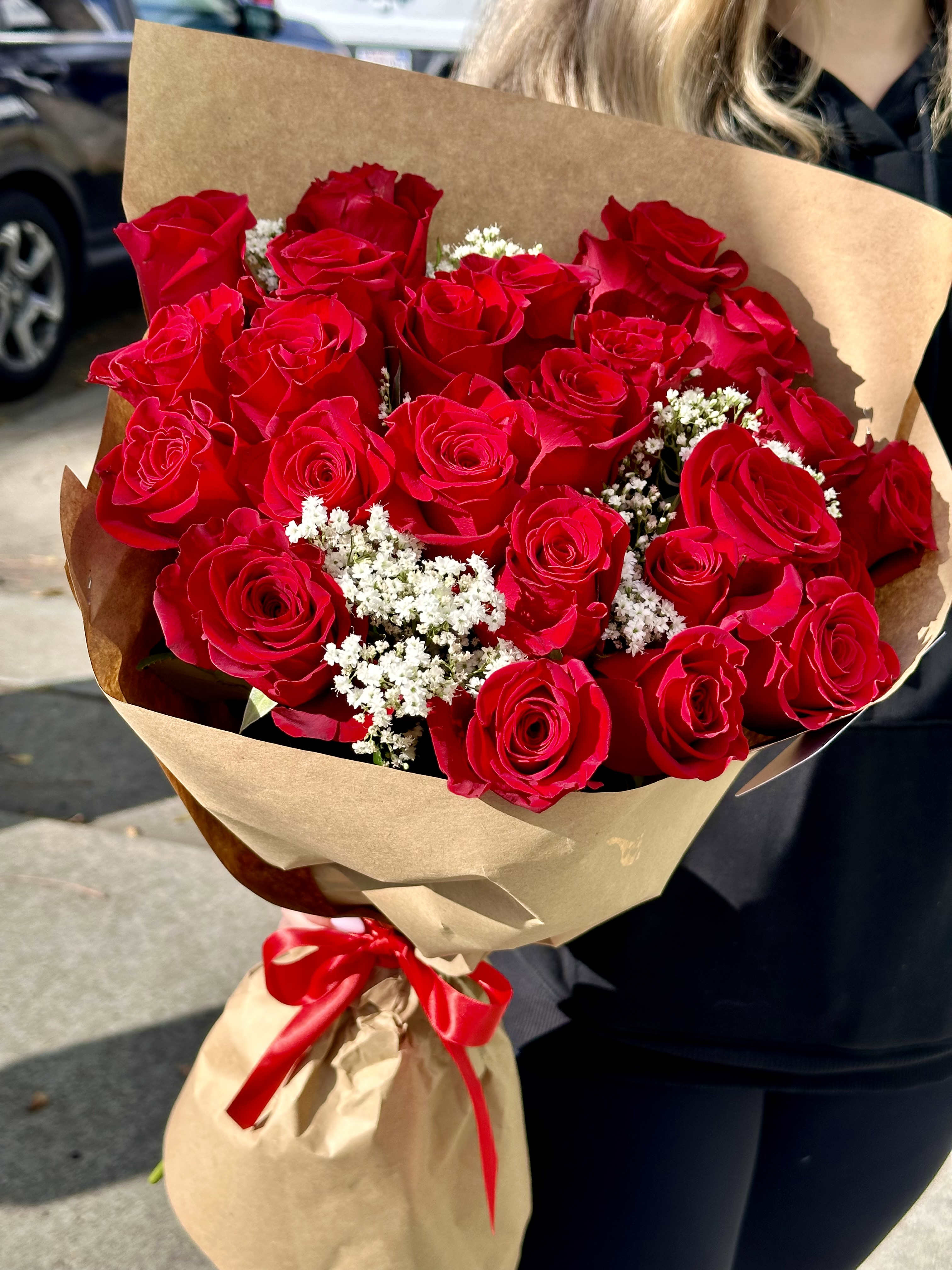 Classy Rose bouquet - An elegant bouquet of red roses with a subtle touch of baby's breath or wax flowers. 
