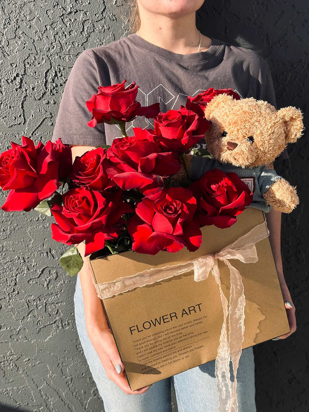 Teddy in Love - Discover timeless romance with our "Teddy in Love" arrangement—a captivating blend of 12 freshest red roses and a cuddly teddy bear, elegantly presented in a charming craft bag. Express your affection with this exquisite bouquet that speaks the language of love. Perfect for special occasions or just because. Order yours for a touch of romance.